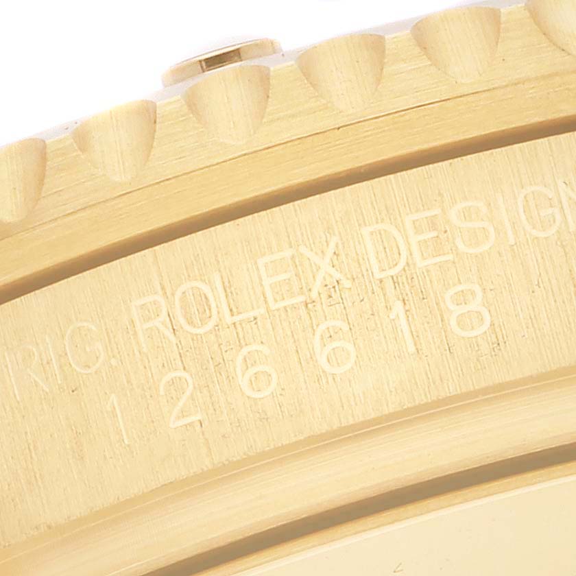 This image shows a close-up of the bezel and case side of a Rolex Submariner 126618 Men's Yellow Gold Black Dial 126618 Men's Yellow Gold Black Dial, highlighting the model number and design engraving.