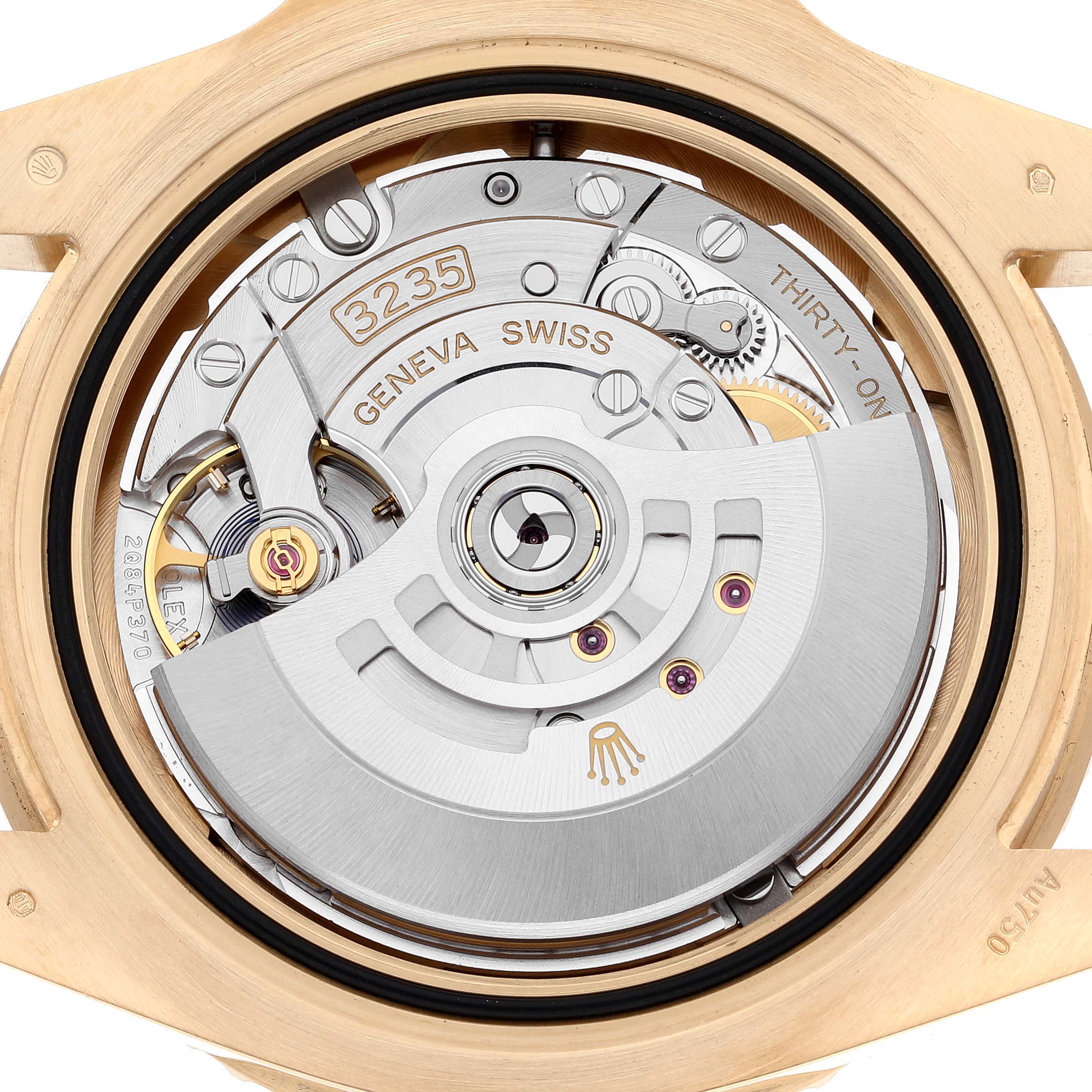 The image shows a close-up view of the movement inside the Rolex Submariner 126618 Men's Yellow Gold Black Dial 126618 Men's Yellow Gold Black Dial, highlighting the intricate gear mechanisms.