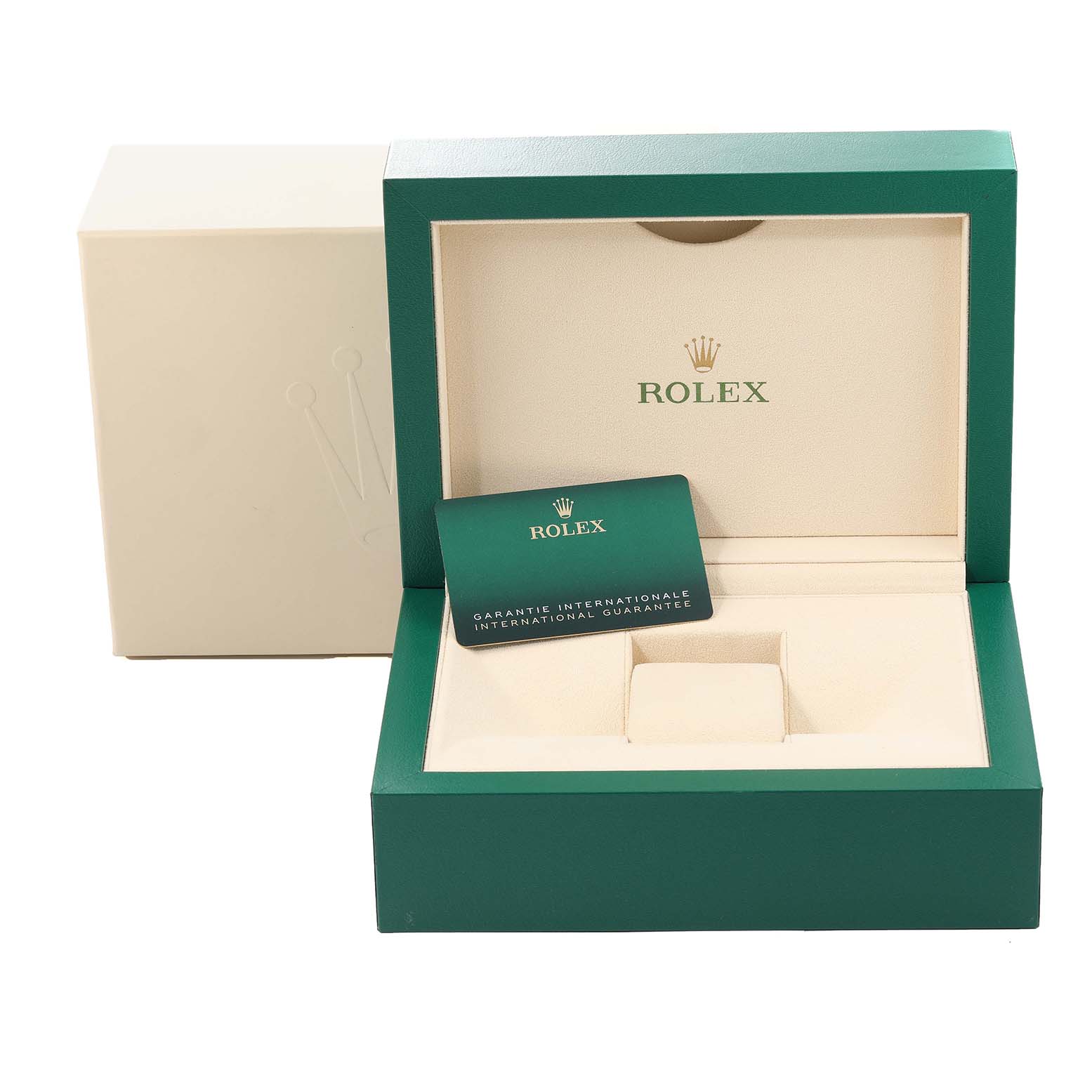 The image shows an open green Rolex box and guarantee card for the Yacht-Master model, with closed and removed packaging in the back.