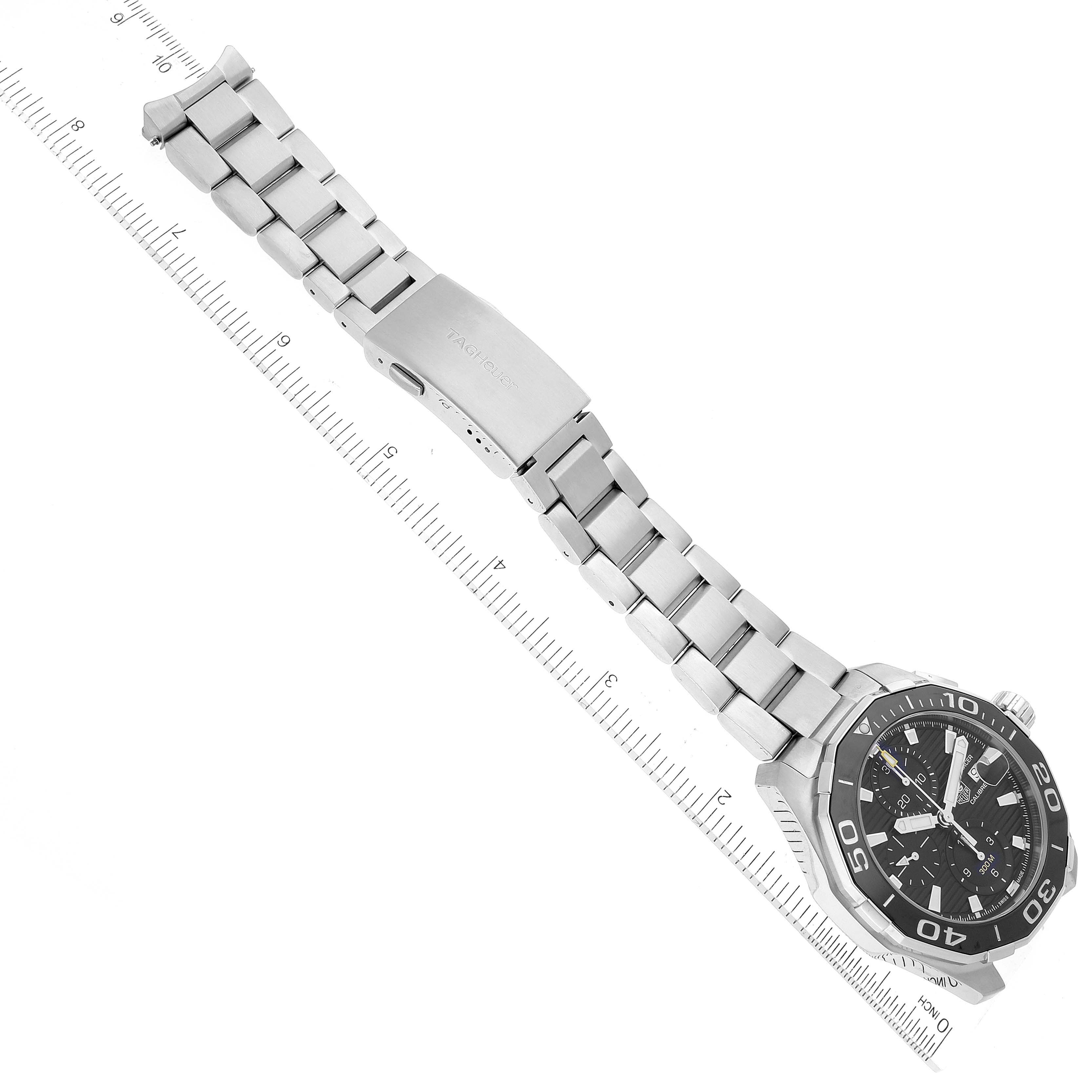 The image shows a Tag Heuer Aquaracer CAY211A Men's Stainless Steel Black Dial CAY211A Men's Stainless Steel Black Dial watch at an angle, displaying its face, bezel, and partially open bracelet.