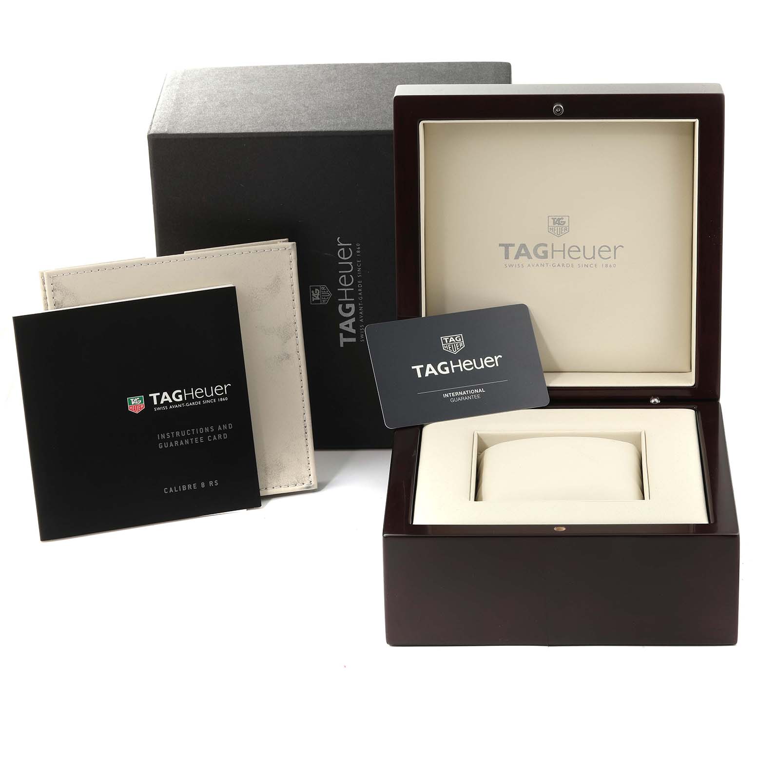 The image shows the box and accessories of a Tag Heuer Carrera WAV5152.FC6231 Men's Steel and Gold (two tone) Silver Dial WAV5152.FC6231 Men's Steel and Gold (two tone) Silver Dial watch including the packaging, warranty card, and instruction manual.