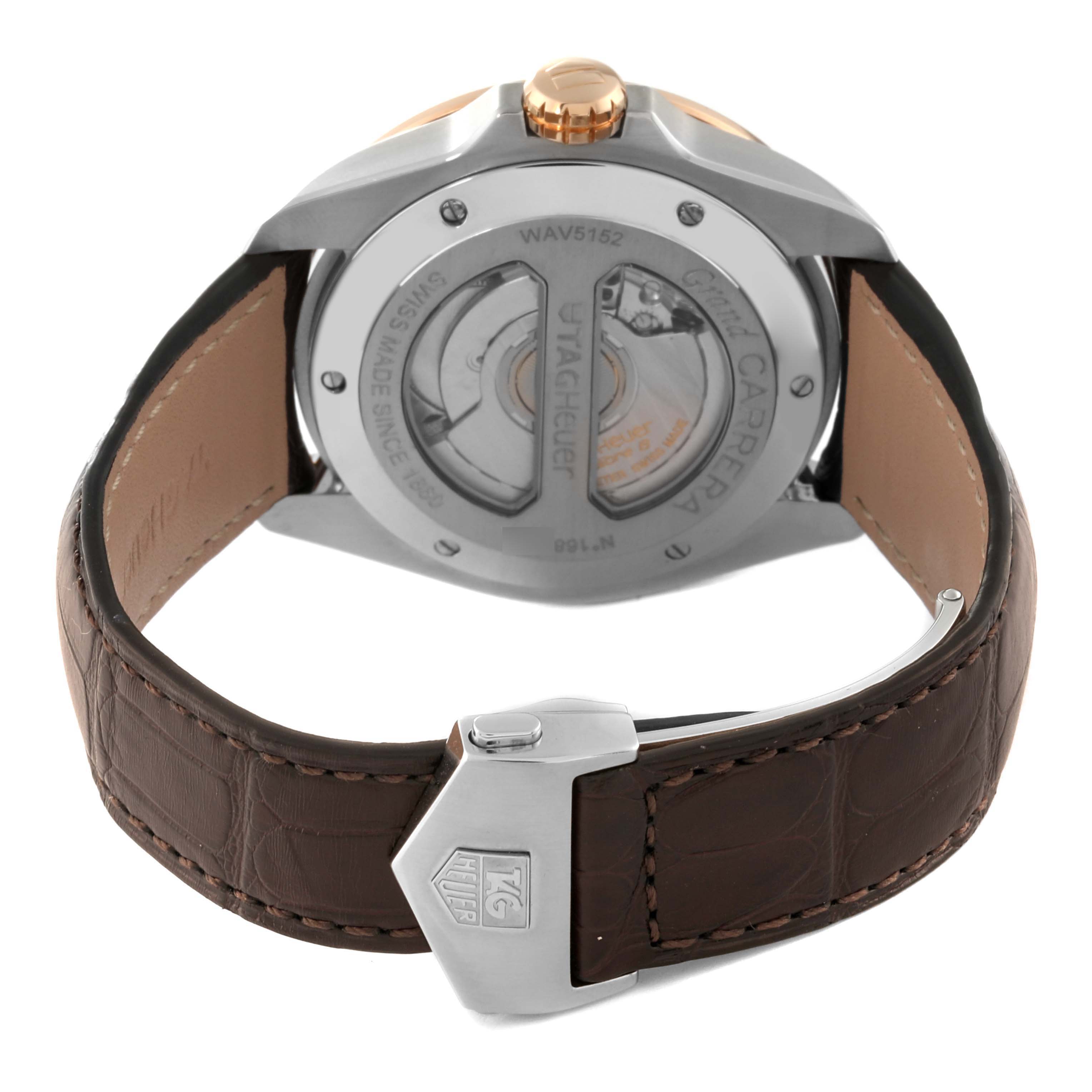 The image shows the back view of a Tag Heuer Carrera WAV5152.FC6231 Men's Steel and Gold (two tone) Silver Dial WAV5152.FC6231 Men's Steel and Gold (two tone) Silver Dial watch, highlighting its movement mechanism and brown leather strap.