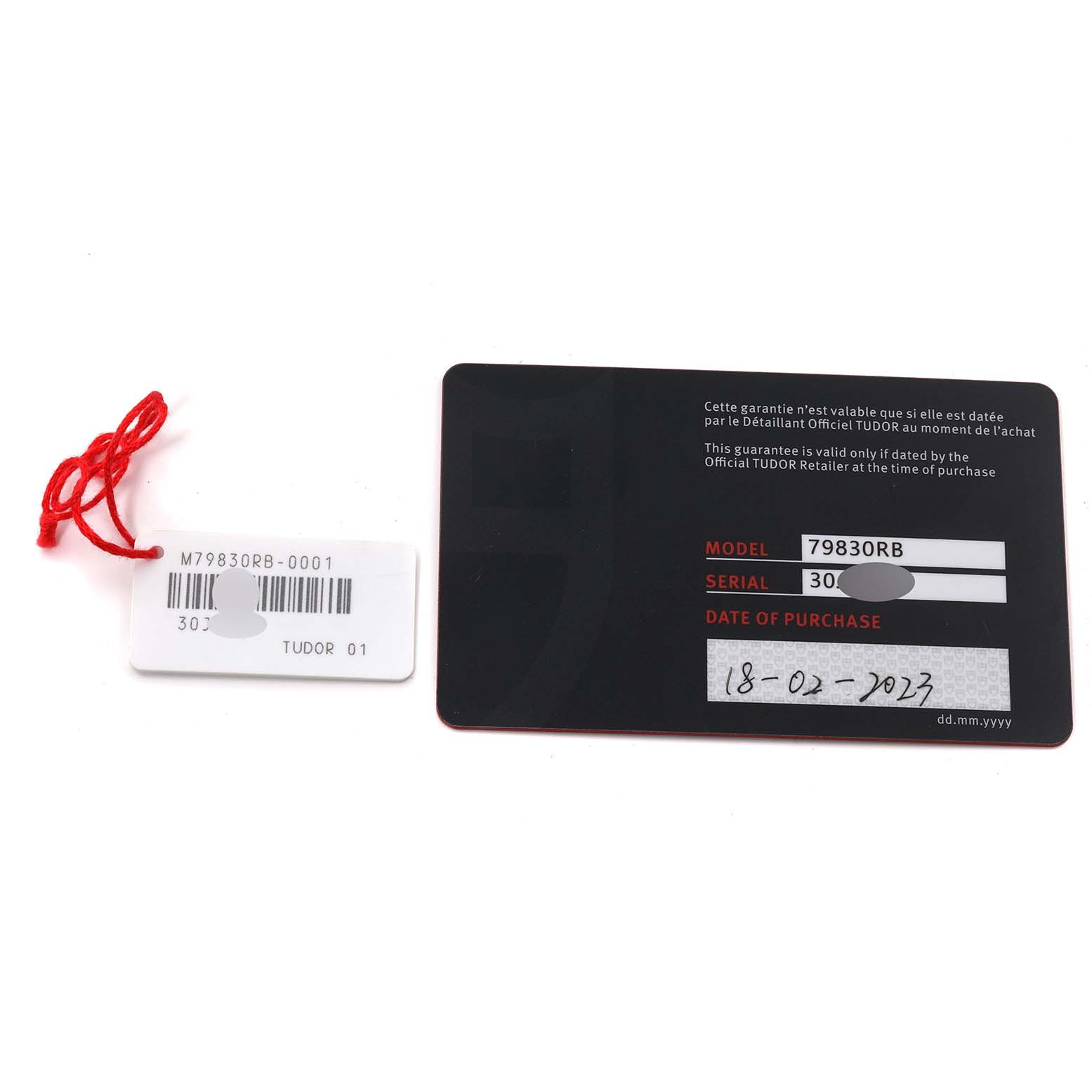 This image shows the tag and warranty card for the Tudor Heritage Black Bay 79830RB Men
s Stainless Steel Black Dial 79830RB Men
s Stainless Steel Black Dial model watch.