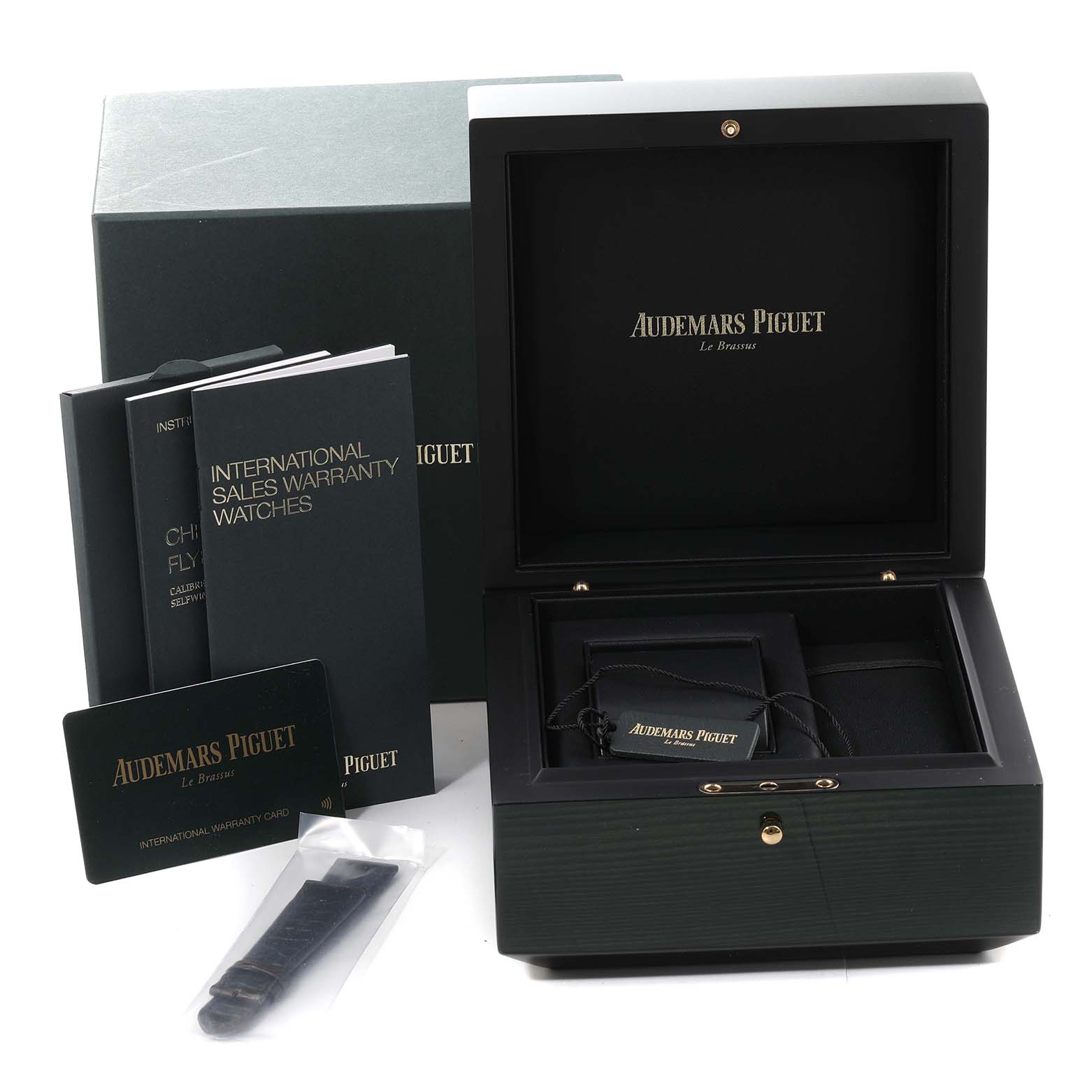 The image shows the packaging, documents, and accessories of an Audemars Piguet Remaster  26595SR.OO.A032VE.01 Men's Stainless Steel Champagne Dial 26595SR.OO.A032VE.01 Men's Stainless Steel Champagne Dialmodel watch from a front angle.