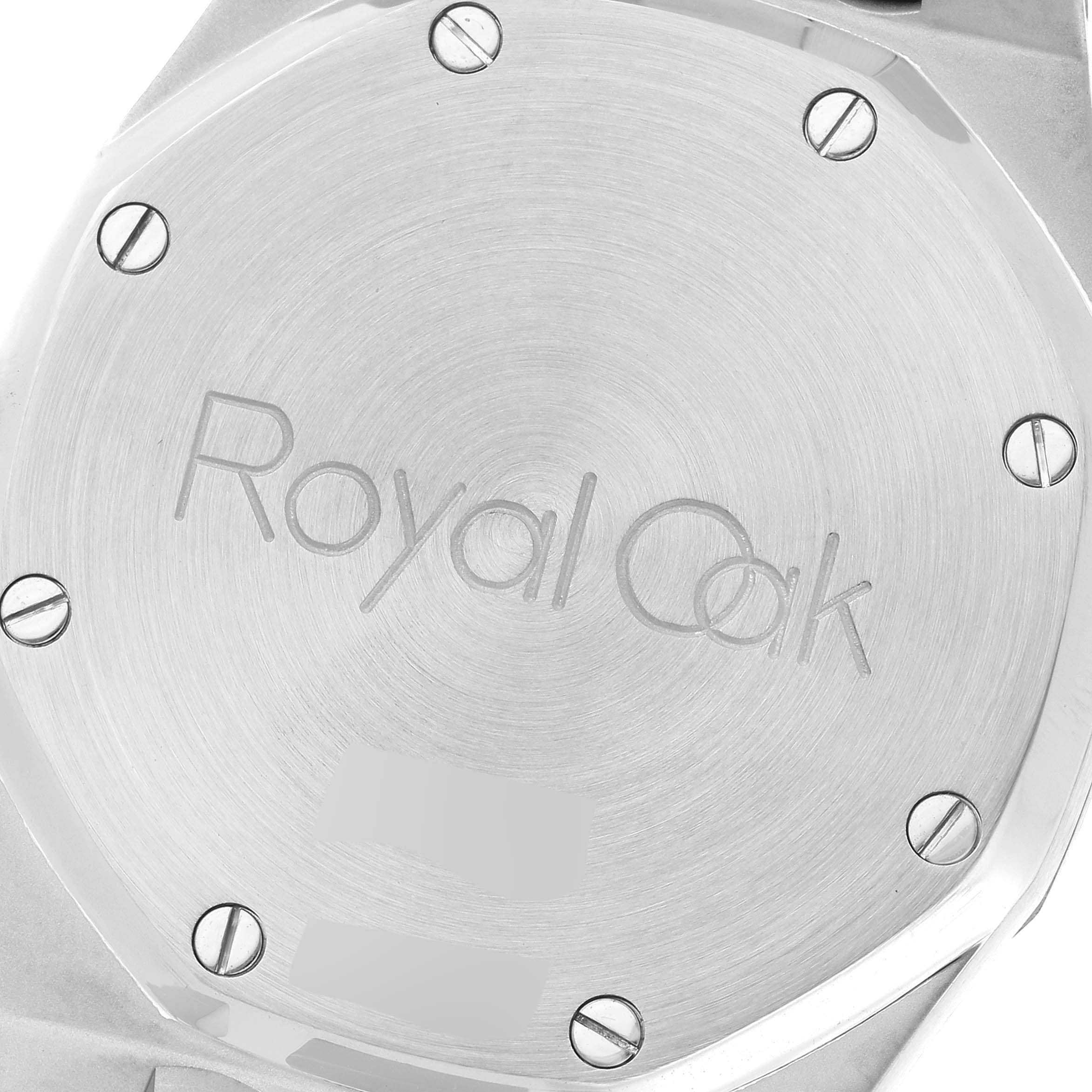 The image shows the case back of an Audemars Piguet Royal Oak 14790ST Men's Stainless Steel Silver Dial 14790ST Men's Stainless Steel Silver Dial watch, featuring its engraved name and screws.