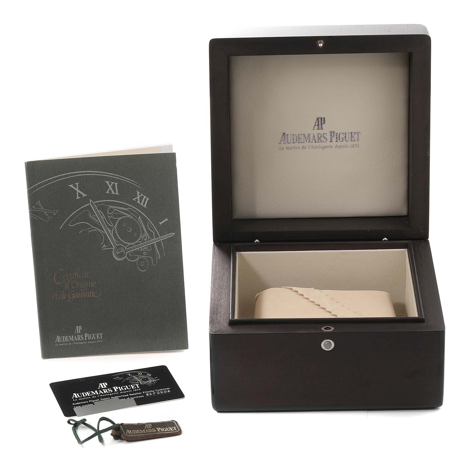 This image shows an open Audemars Piguet Royal Oak 14790ST Men's Stainless Steel Silver Dial 14790ST Men's Stainless Steel Silver Dial watch box, warranty card, booklet, and a watch tag.