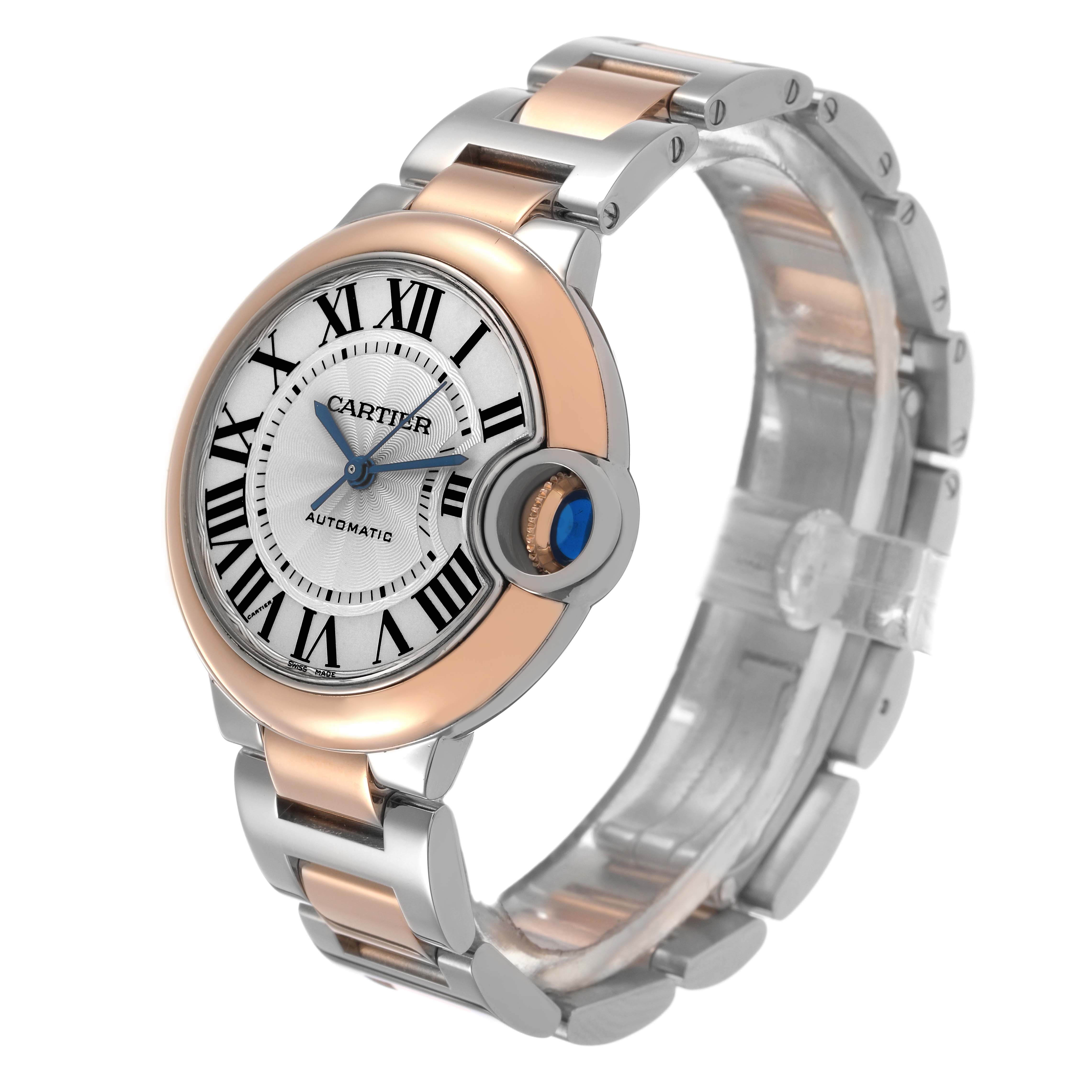 The Cartier Ballon Bleu W2BB0032 Women's Steel and Gold (two tone) Silver Dial watch is shown at a three-quarter angle, featuring its steel and rose gold bracelet, with a close-up of the crown.