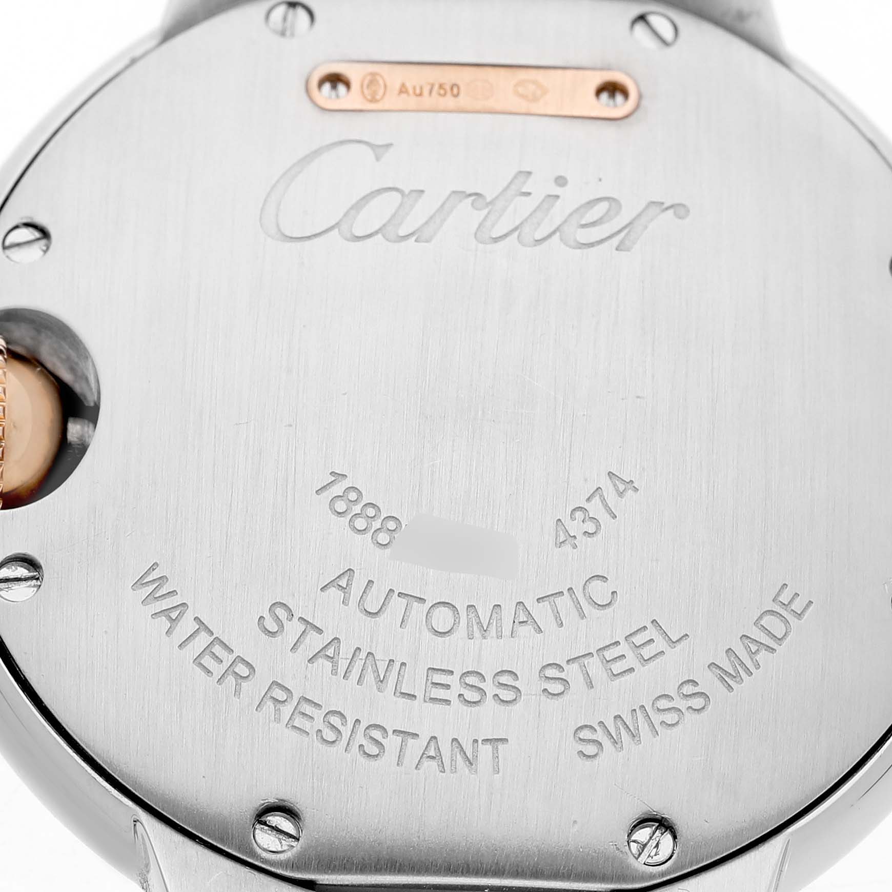 The image shows the back of a Cartier Ballon Bleu W2BB0032 Women's Steel and Gold (two tone) Silver Dial watch, focusing on the engraved details and branding.
