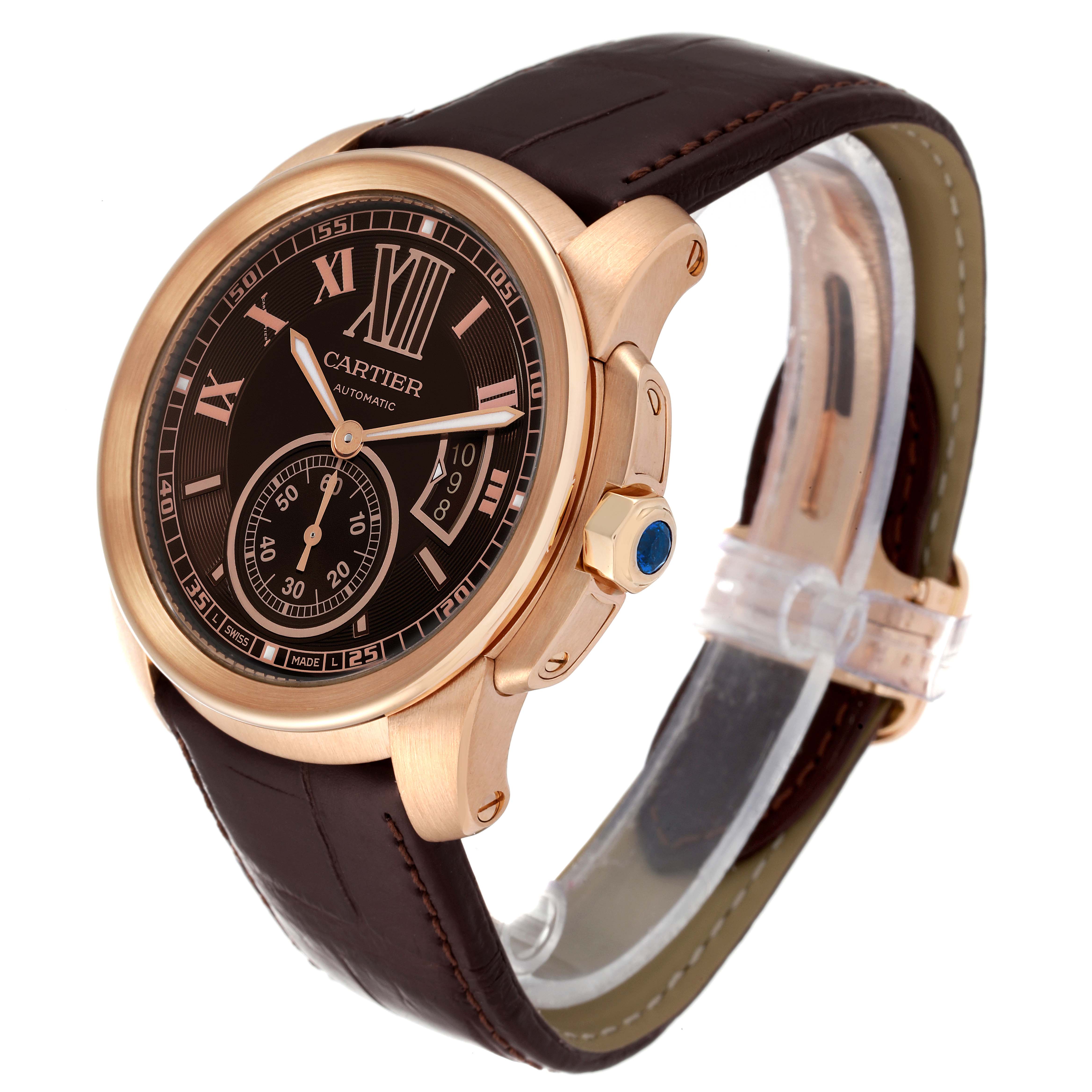 The image shows a Calibre de Cartier watch by Cartier from a front-right angle, highlighting the face, bezel, crown, and leather strap.