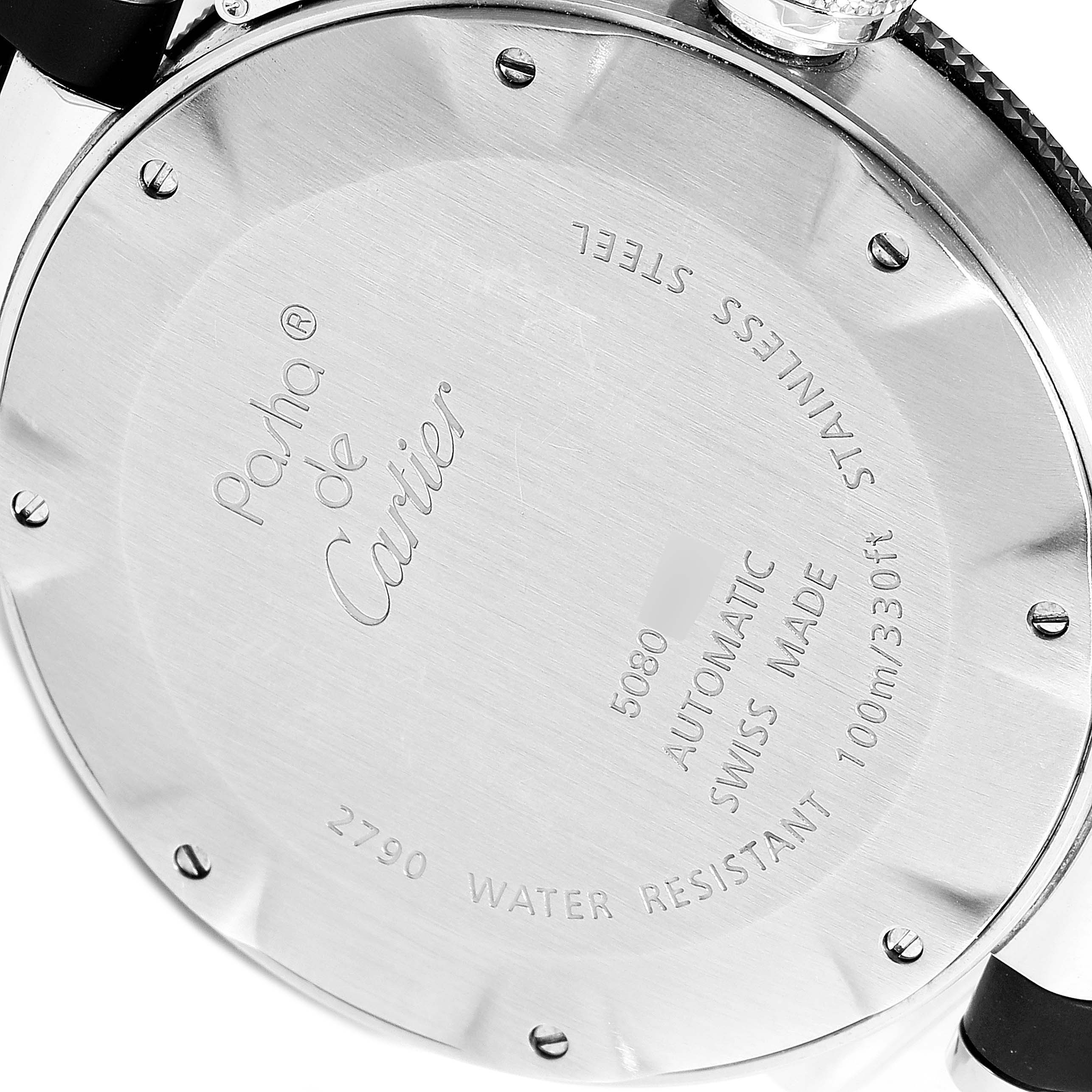 The image shows the back of a Pasha de Cartier watch, displaying engravings for model number and specifications.