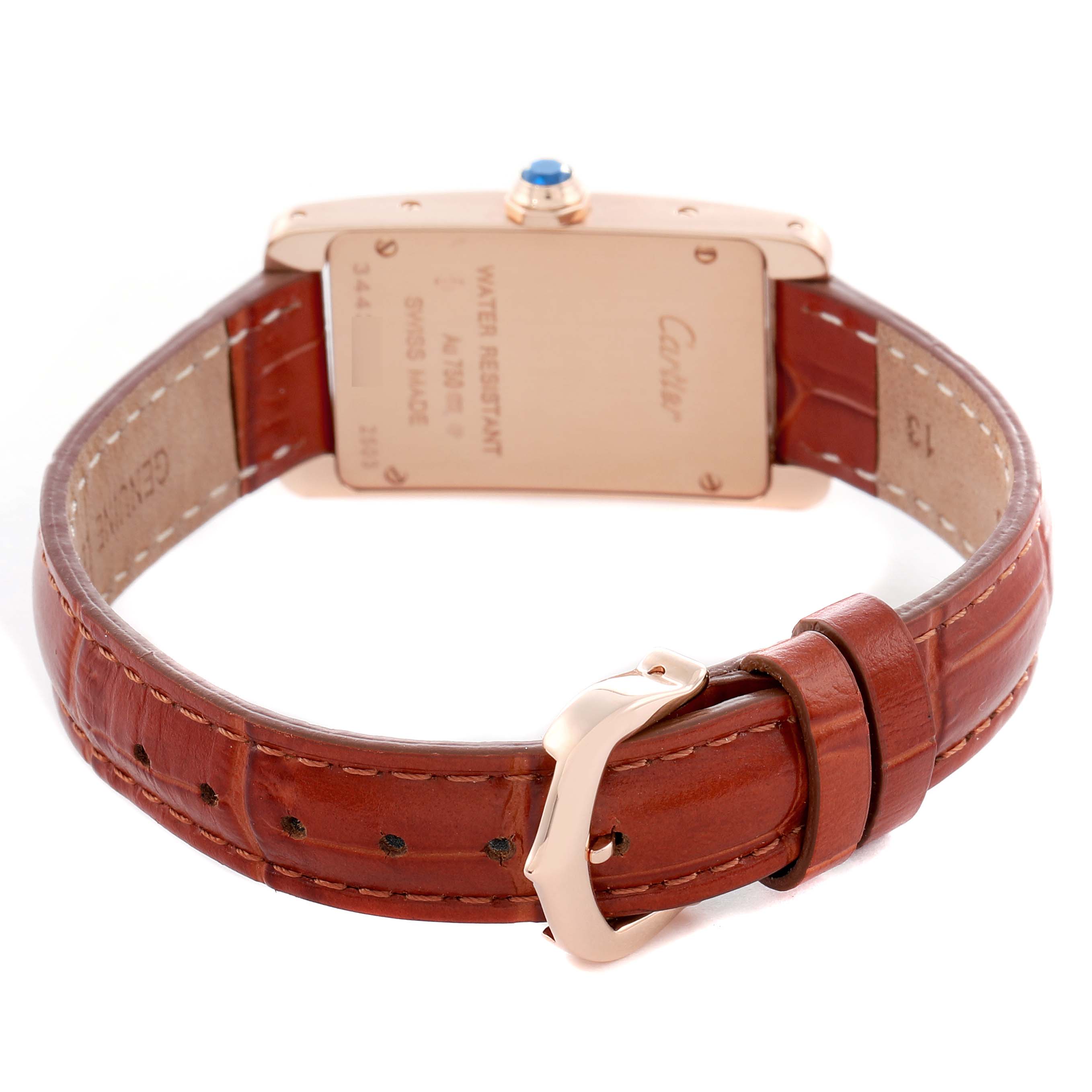 The image shows a rear view of the Cartier Tank Americaine W2607456 Women's Rose Gold Silver Dial watch, highlighting the case back, crown, and leather strap with buckle.