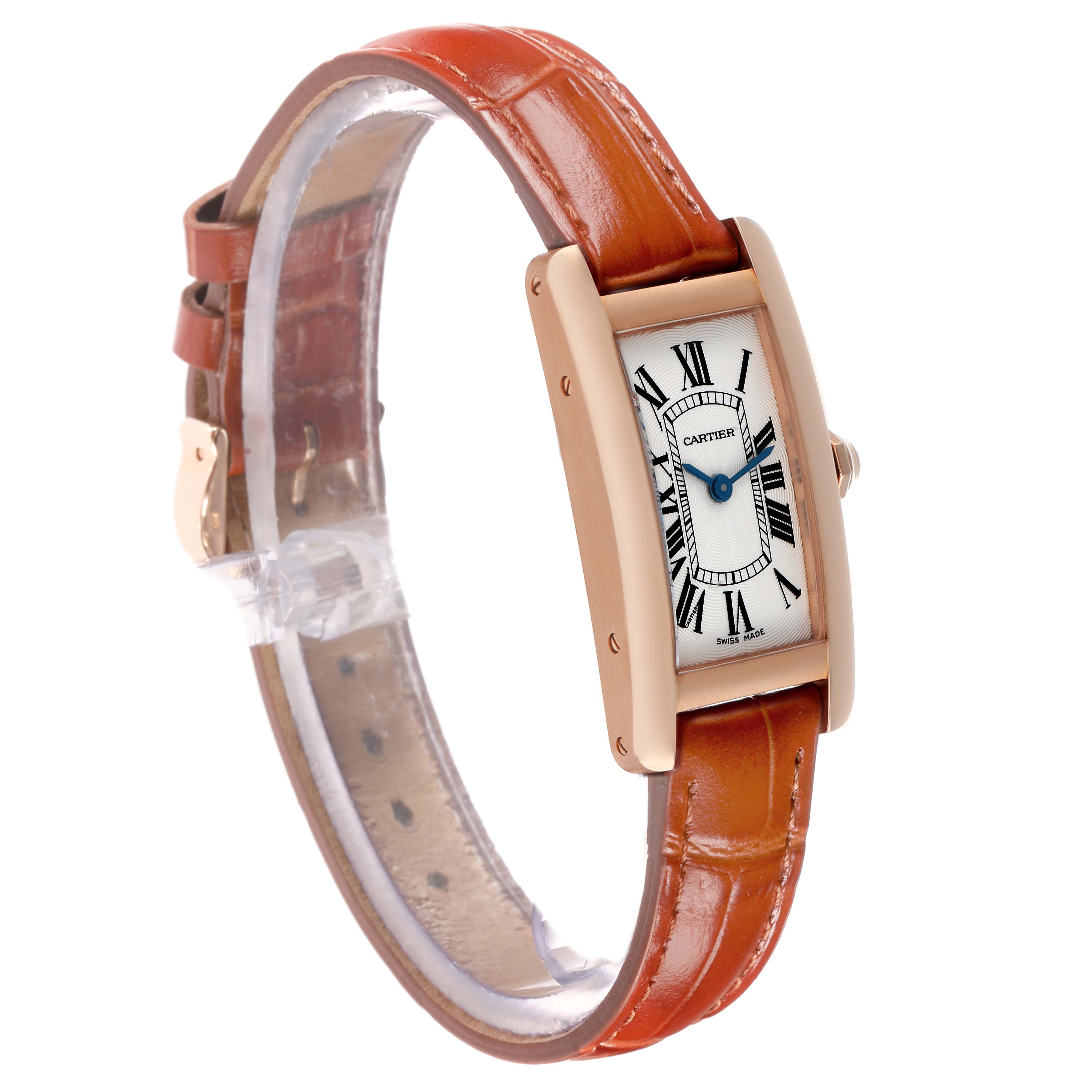 The Cartier Tank Americaine W2607456 Women's Rose Gold Silver Dial watch is shown at a three-quarter angle, highlighting its face, case, and leather strap.