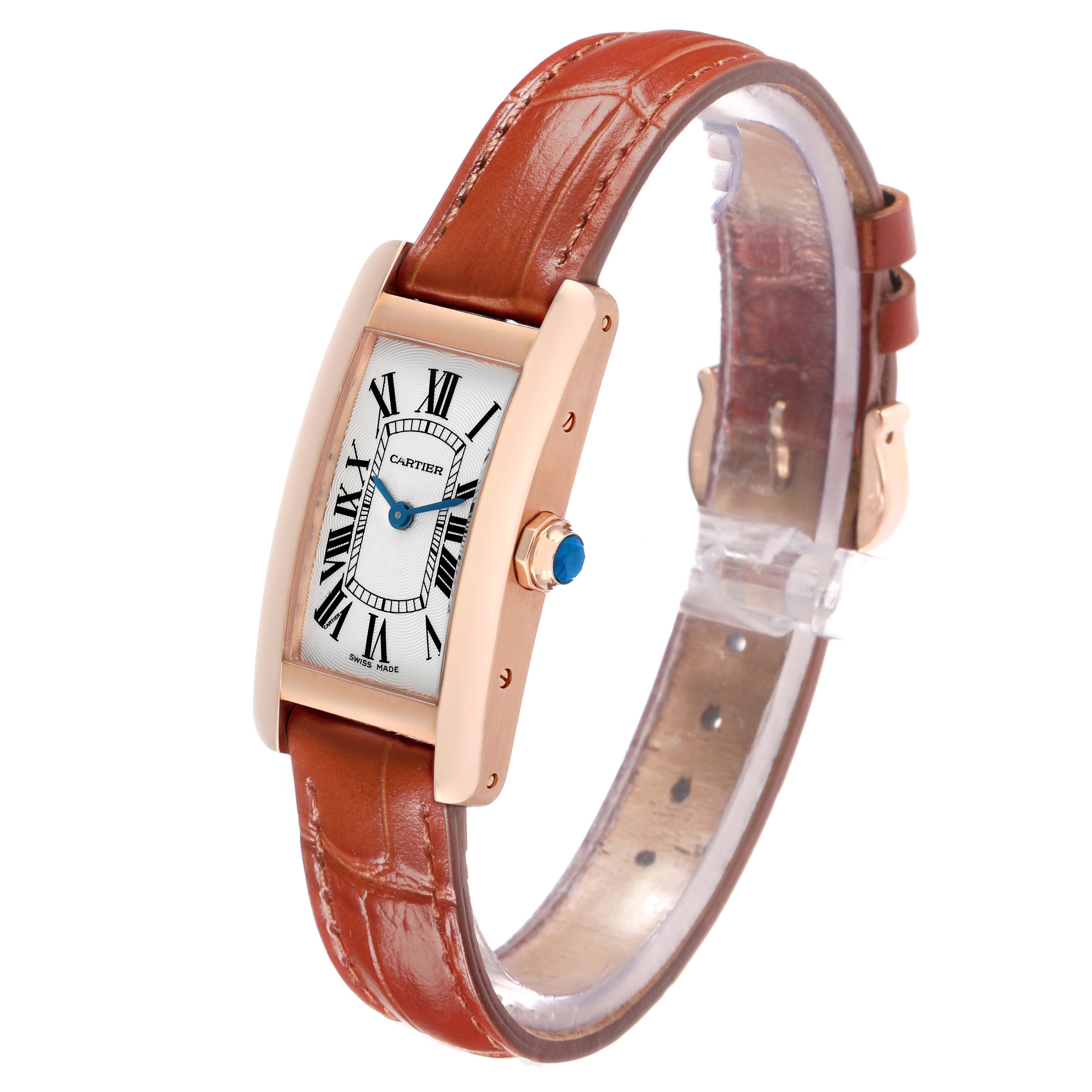 The Cartier Tank Americaine W2607456 Women's Rose Gold Silver Dial watch is shown at an angled side view, highlighting the dial, crown, and leather strap.