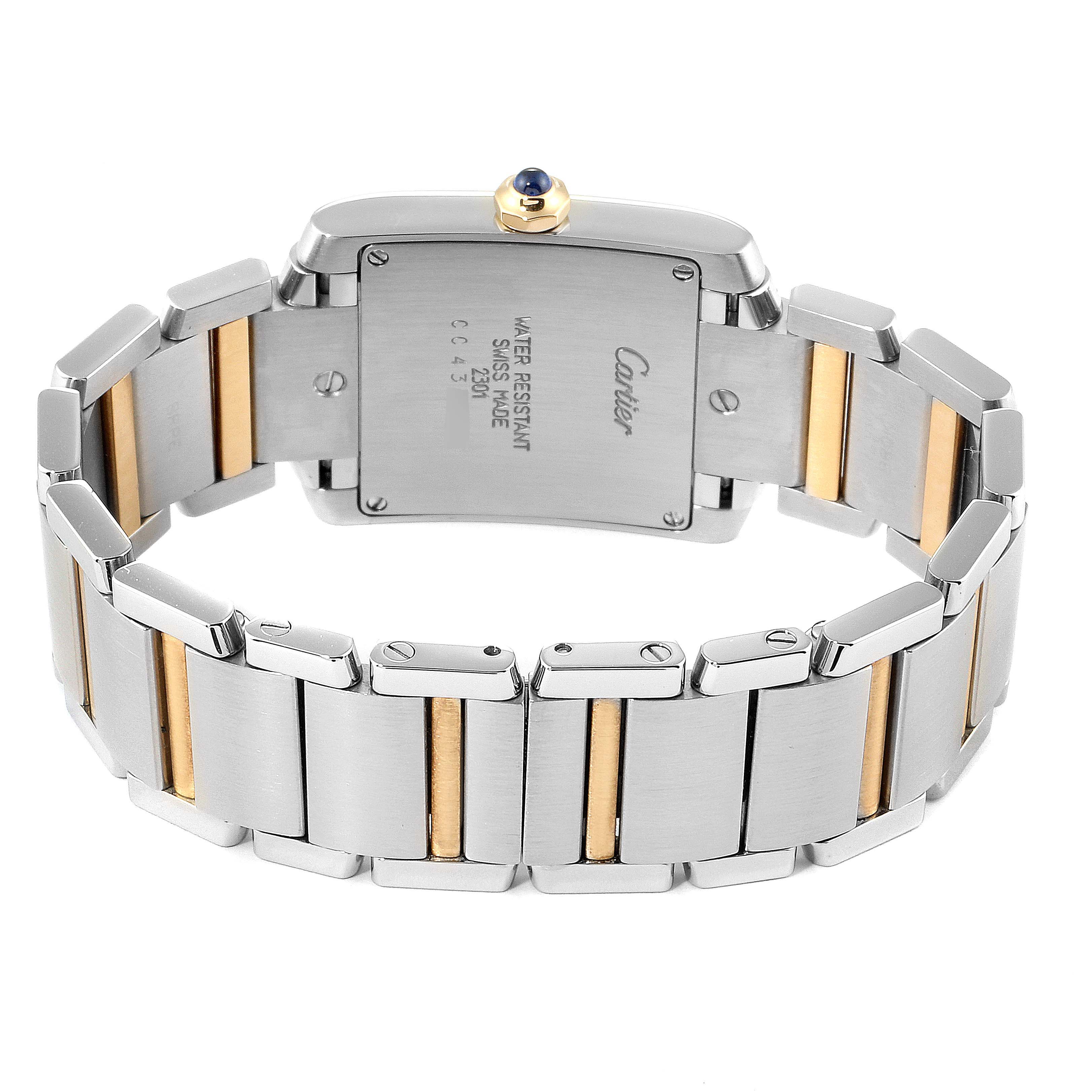 The image shows the back view of a Cartier Tank Francaise W2TA0003 Women's Steel and Gold (two tone) Silver Dial W2TA0003 Women's Steel and Gold (two tone) Silver Dial watch, highlighting the case back and the two-tone bracelet.