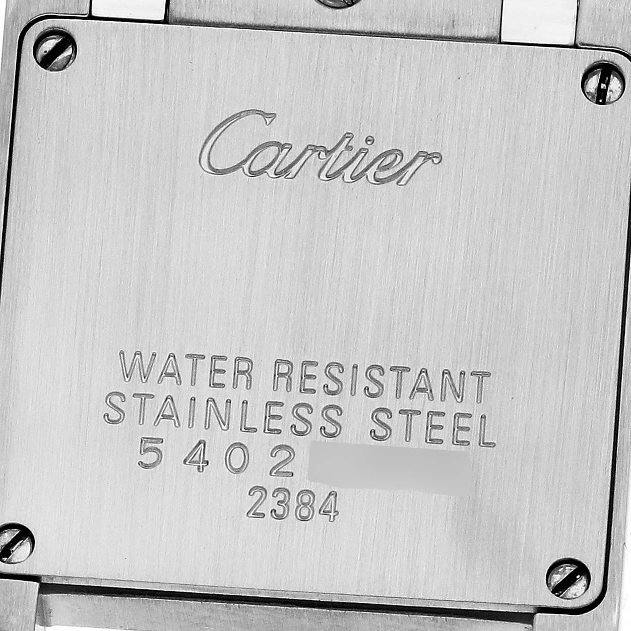 This image shows the back case of the Cartier Tank Francaise W51028Q3 Women's Stainless Steel Mother of Pearl Dial W51028Q3 Women's Stainless Steel Mother of Pearl Dial watch, highlighting engravings of the brand and material information.