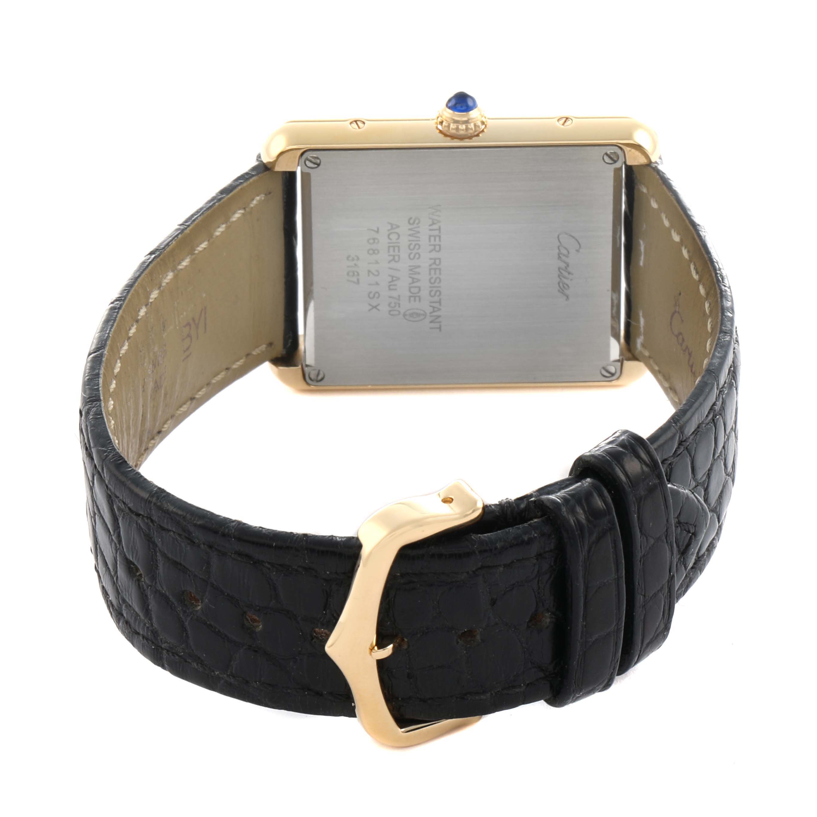 The image shows the back of the Cartier Tank Solo W5200004 Men
s Steel and Gold (two tone) Silver Dial watch, featuring the case back, leather strap, and buckle.