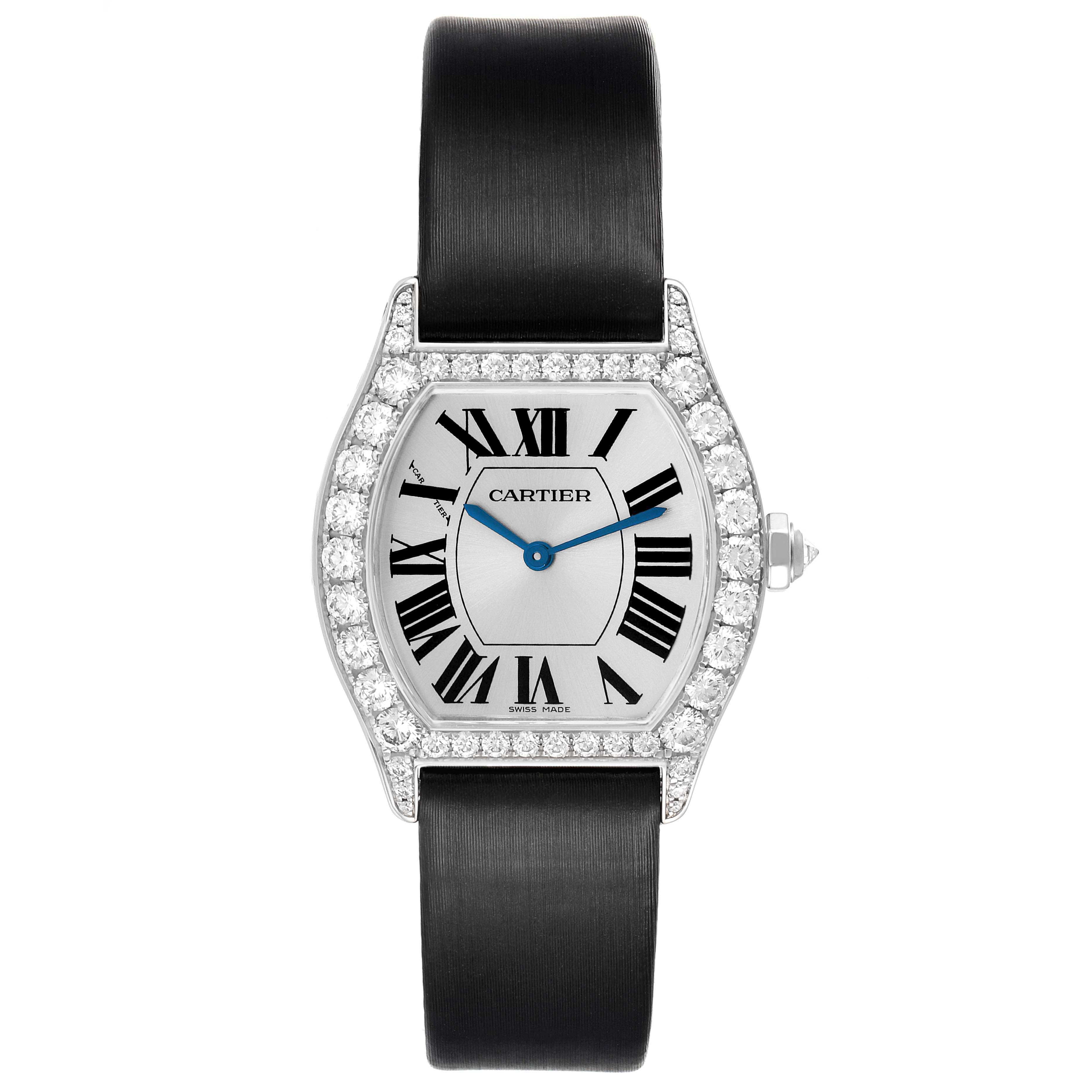 The Cartier Tortue WA507231 Women's White Gold Silver Dial watch is shown from the front, highlighting its diamond-studded bezel and Roman numeral dial.