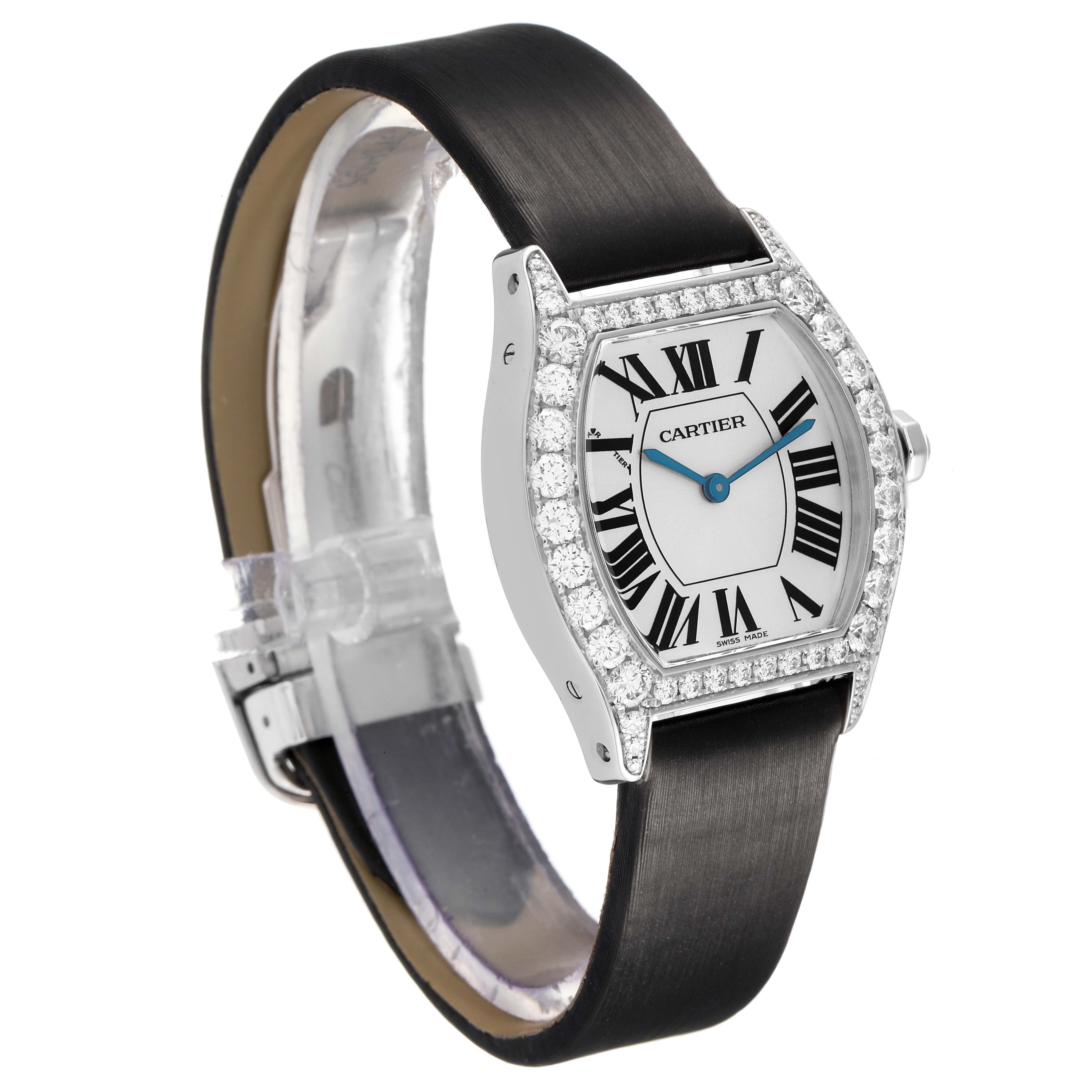 The Cartier Tortue WA507231 Women's White Gold Silver Dial watch is shown at a three-quarter angle, displaying the dial, bezel, and part of the strap.