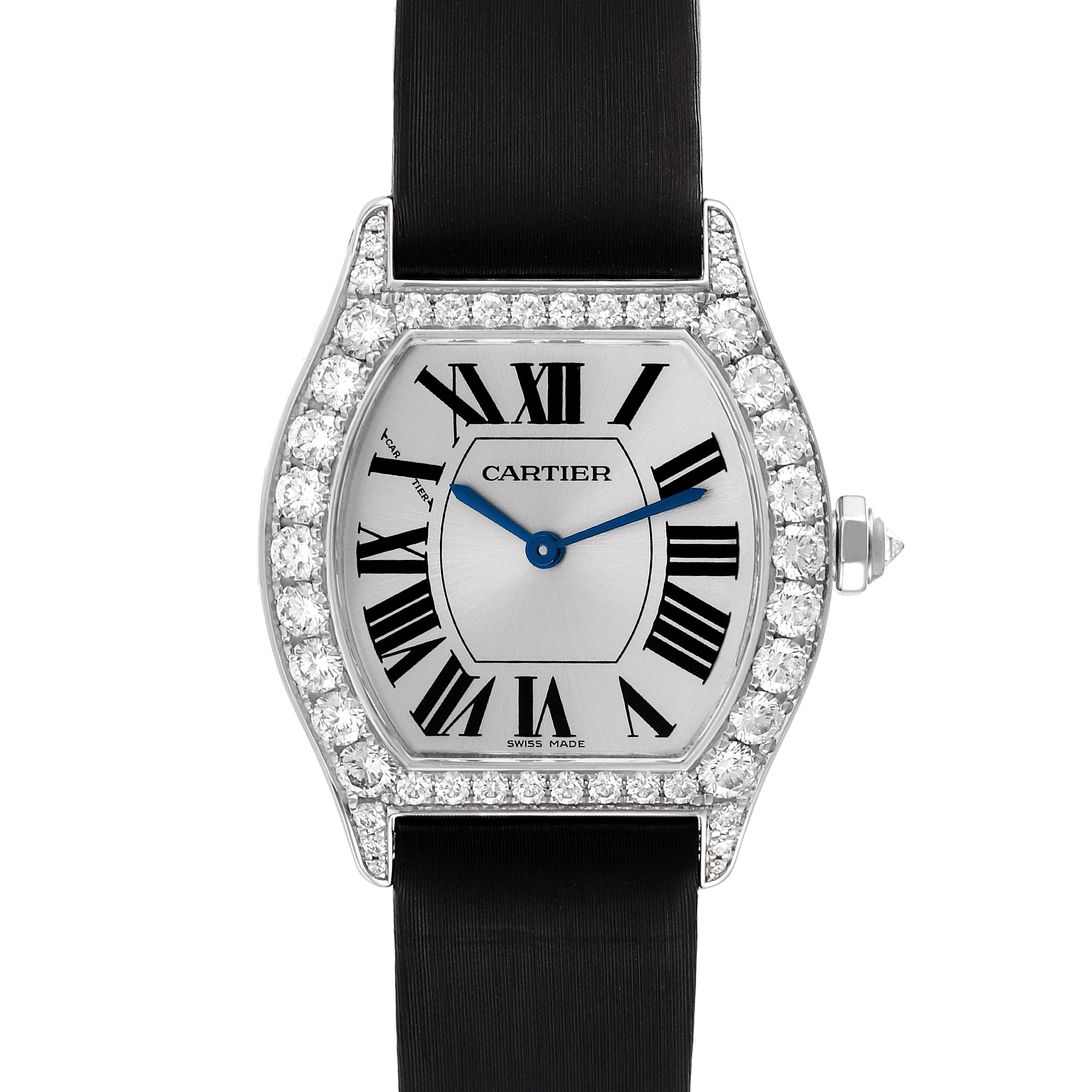 The image shows a Tortue model by Cartier from the front, featuring the watch face, bezel with diamonds, and part of the strap.