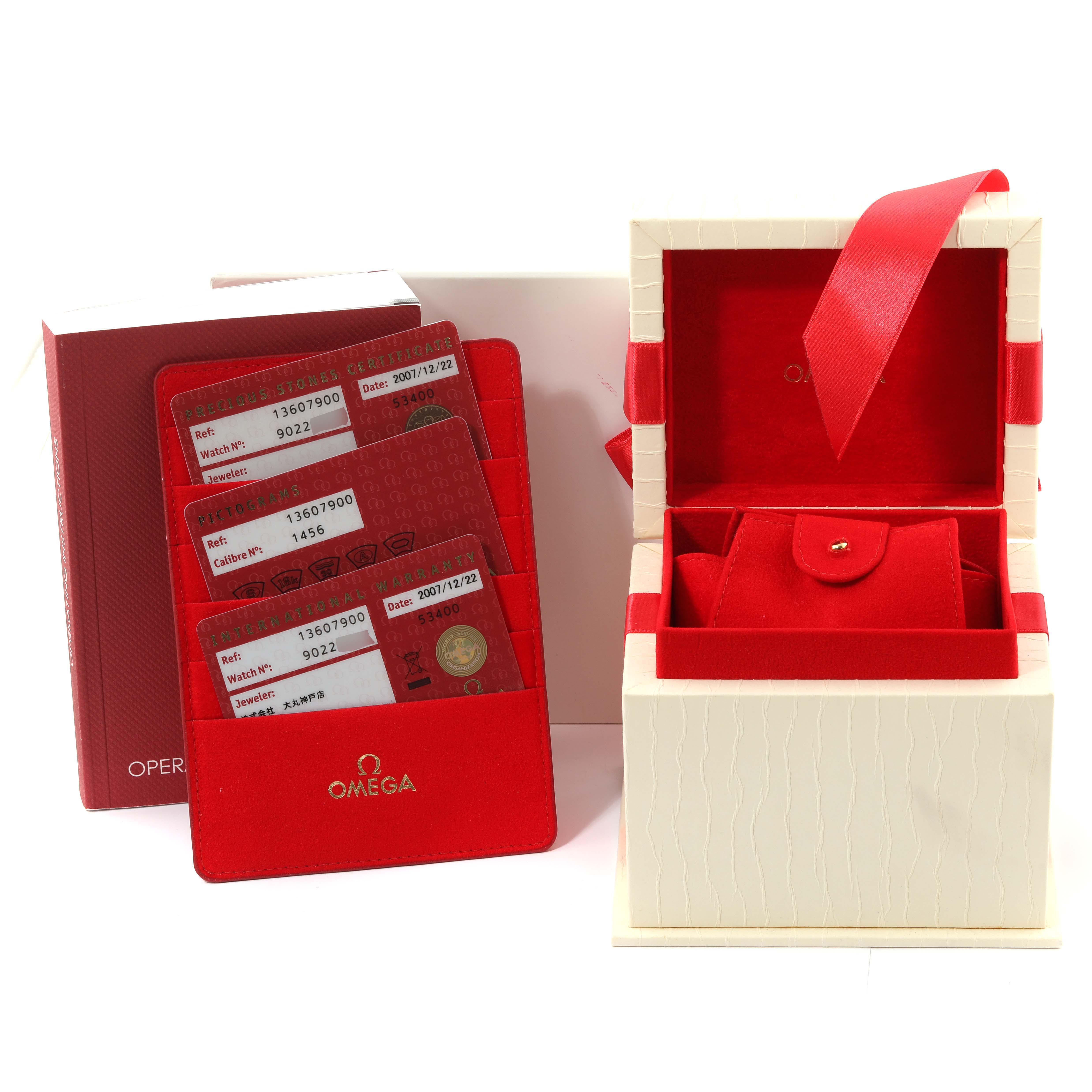 The image shows the packaging, cards, and accessories for the Omega 1360.79.00 Women's Steel and Gold (two tone) Mother of Pearl Dial 1360.79.00 Women's Steel and Gold (two tone) Mother of Pearl Dial Constellation Steel Rose Gold MOP Diamond Ladies Watch 1360.79.00.