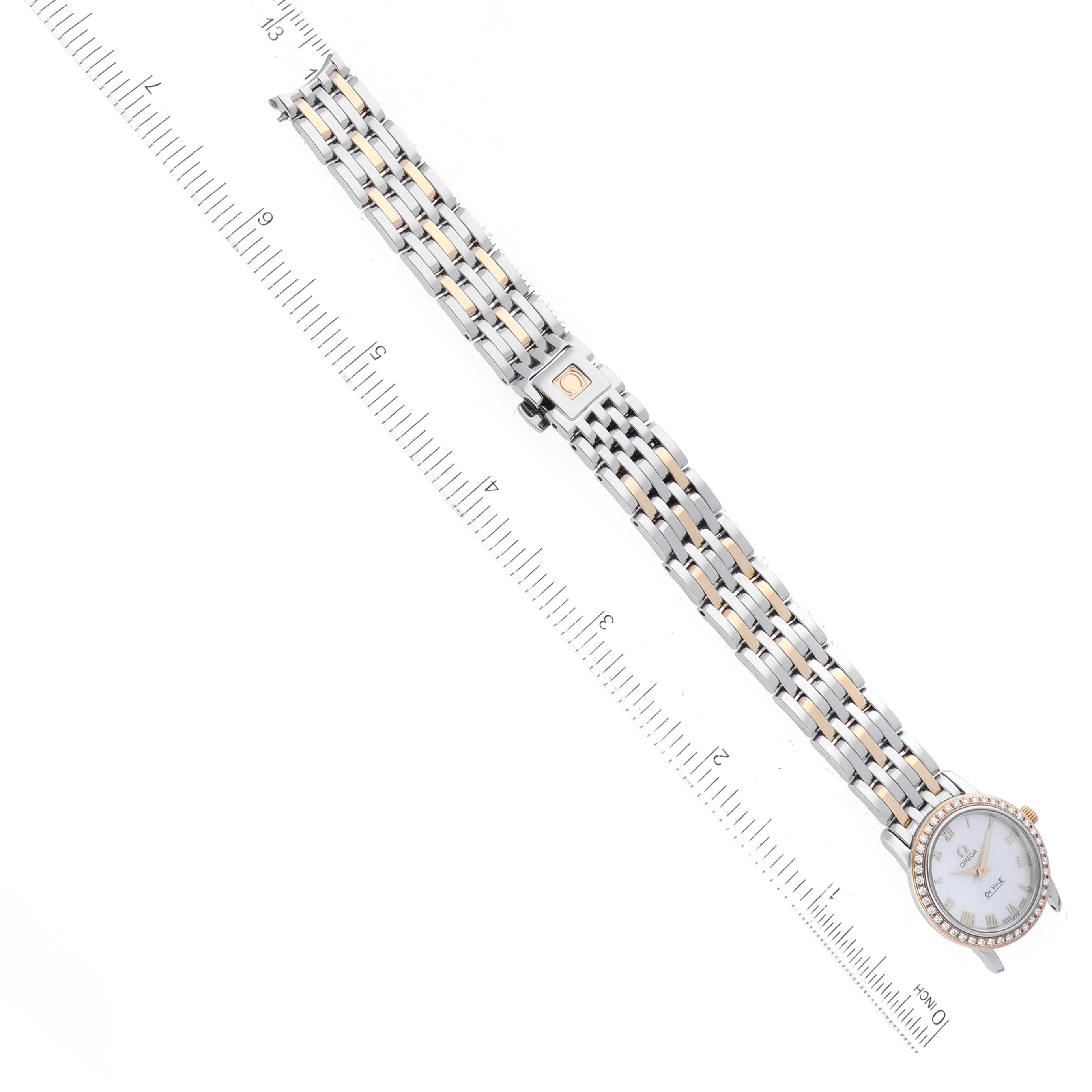 This image shows an Omega 4375.71.00 Women's Steel and Gold (two tone) Mother of Pearl Dial 4375.71.00 Women's Steel and Gold (two tone) Mother of Pearl Dial DeVille Prestige 4375.71.00 Ladies Watch placed diagonally, showcasing its band, clasp, and face.