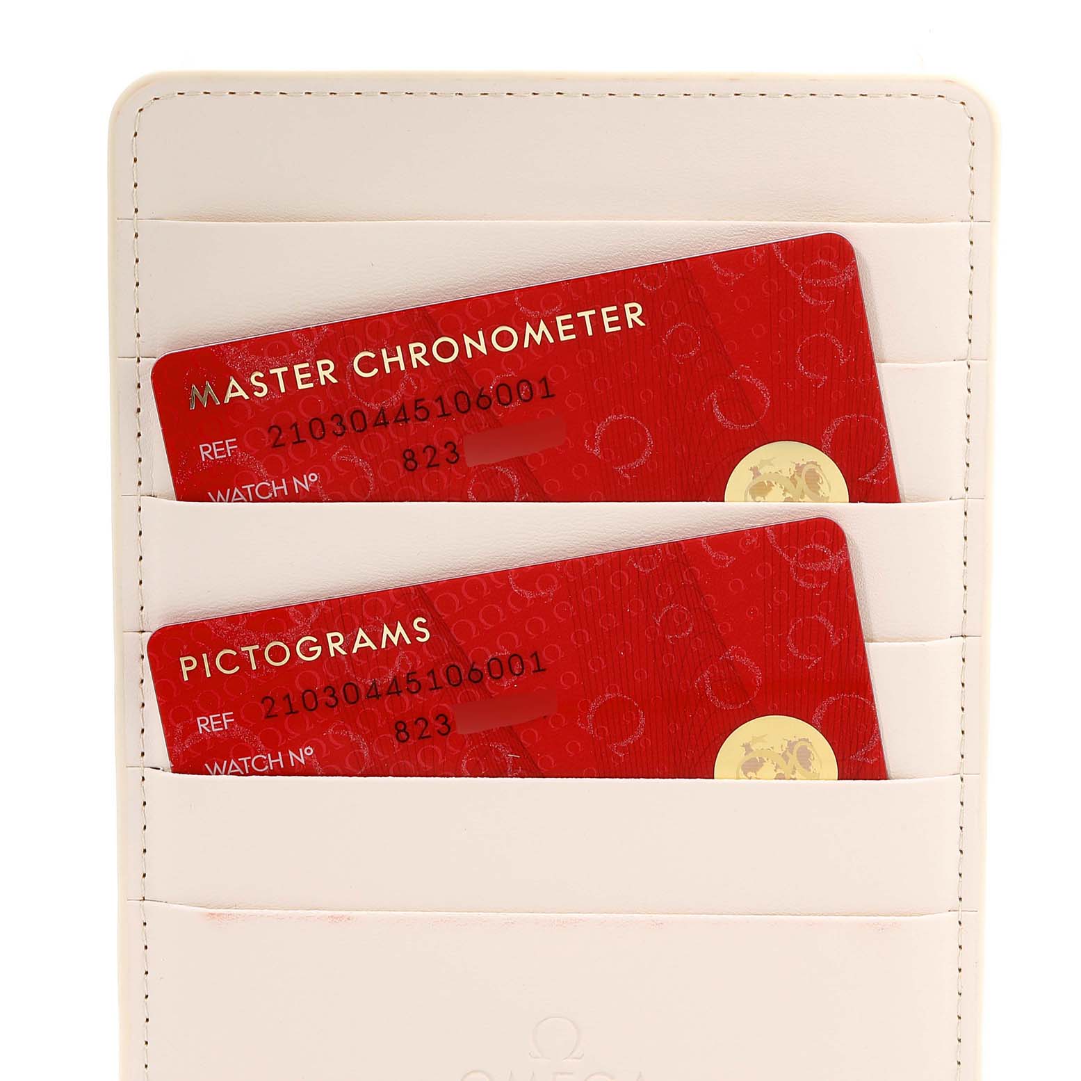 The image shows warranty cards for the Omega Seamaster 210.30.44.51.06.001 Men's Stainless Steel Grey Dial 210.30.44.51.06.001 Men's Stainless Steel Grey Dial model in a cream-colored cardholder.