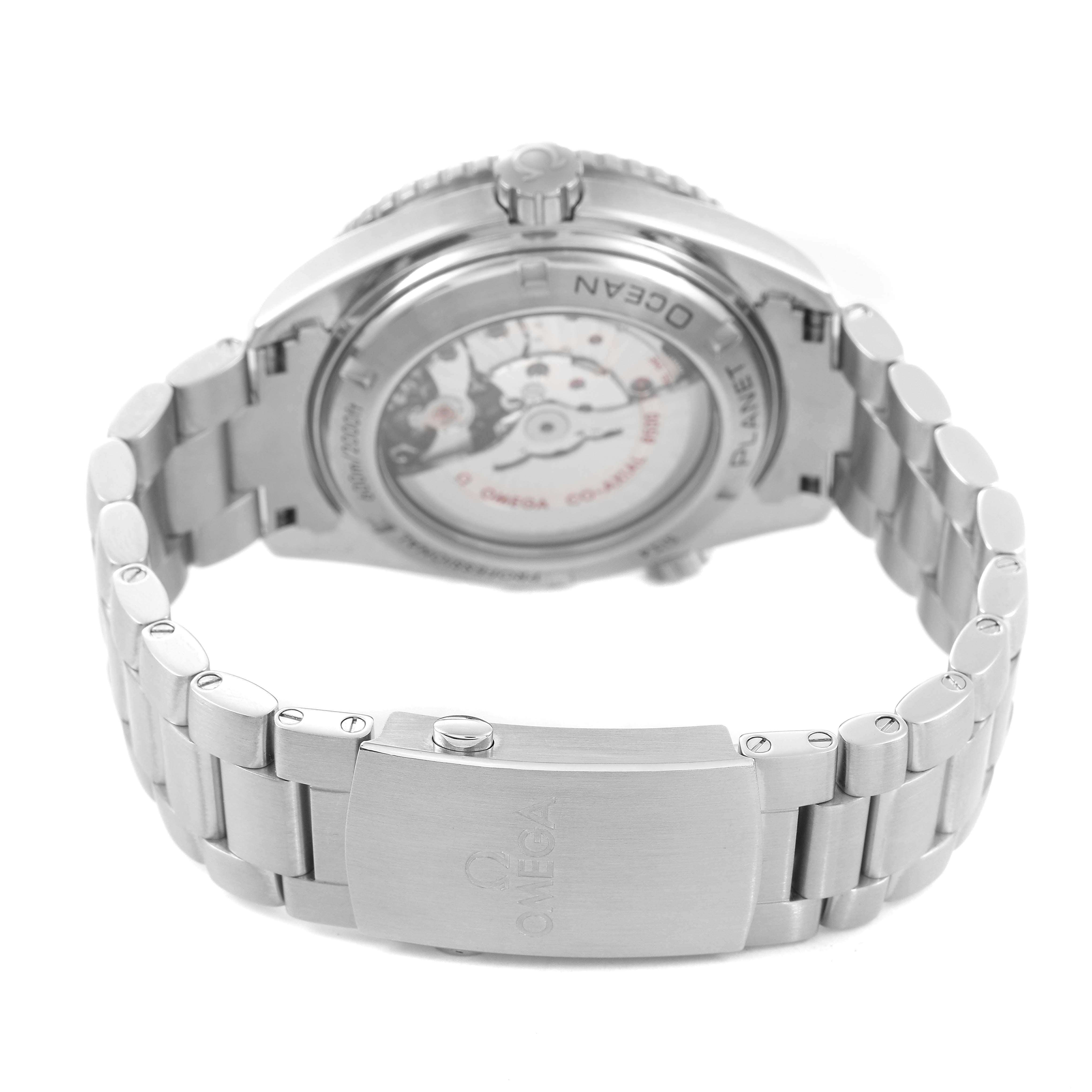 The Omega Planet Ocean 232.30.46.21.01.001 Men's Stainless Steel Black Dial watch is shown from a rear angle, highlighting the back case and metal bracelet clasp.