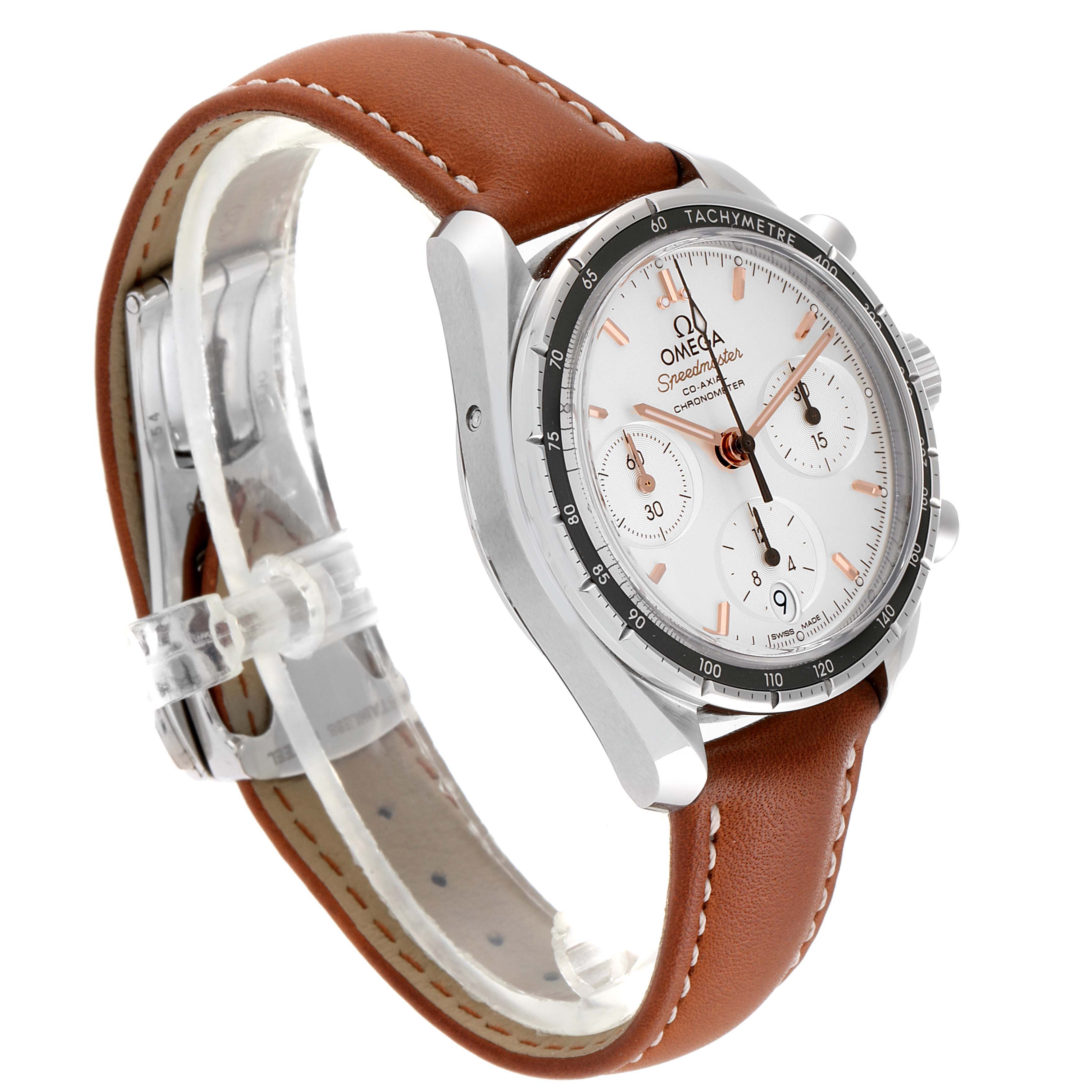 The Omega Speedmaster 324.32.38.50.02.001 Men's Stainless Steel Silver Dial 324.32.38.50.02.001 Men's Stainless Steel Silver Dial watch is shown at a three-quarter angle, highlighting the face, bezel, and brown leather strap.