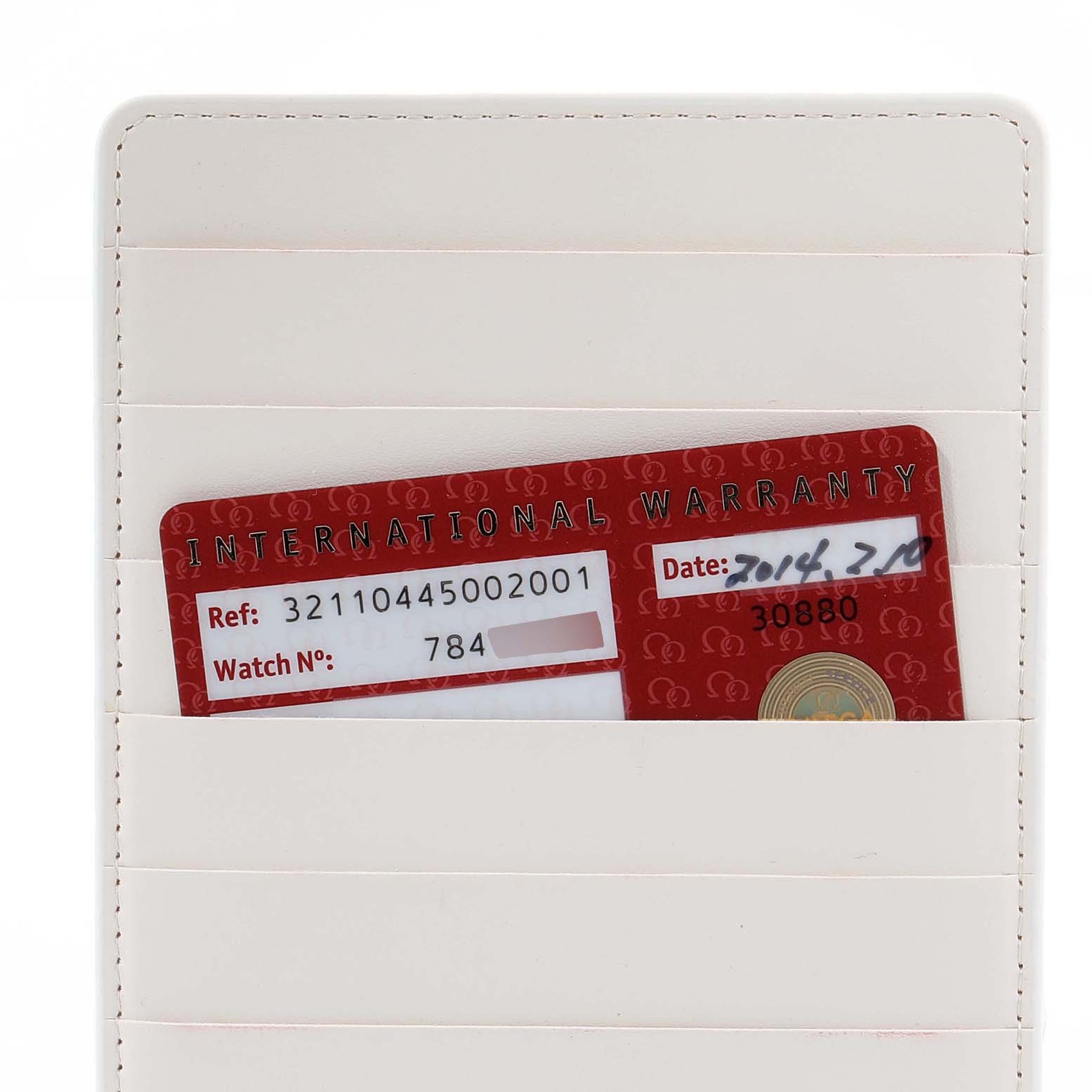 The image shows an Omega Speedmaster 321.10.44.50.02.001 Men's Stainless Steel Silver Dial 321.10.44.50.02.001 Men's Stainless Steel Silver Dial international warranty card placed in a leather cardholder, viewed from the front.