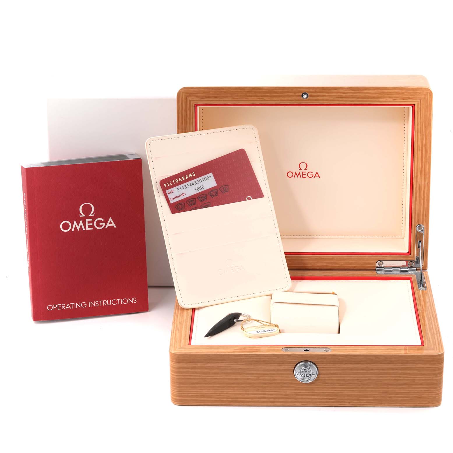 The image shows the Omega Speedmaster 311.33.44.32.01.001 Men's Stainless Steel Black Dial 311.33.44.32.01.001 Men's Stainless Steel Black Dial's wooden box, operating instructions, warranty card holder, and watch cushion.