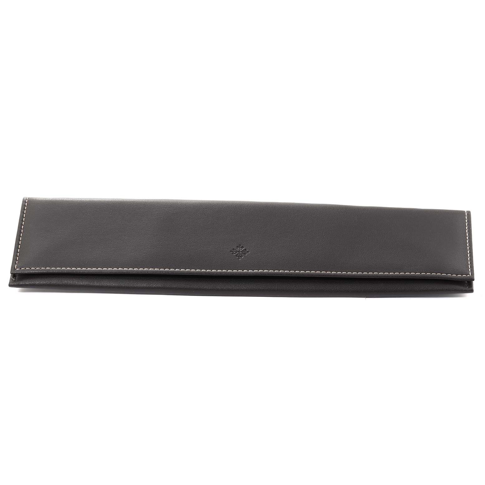 The image shows a closed black leather pouch for the Calatrava model by Patek Philippe, viewed from the front.