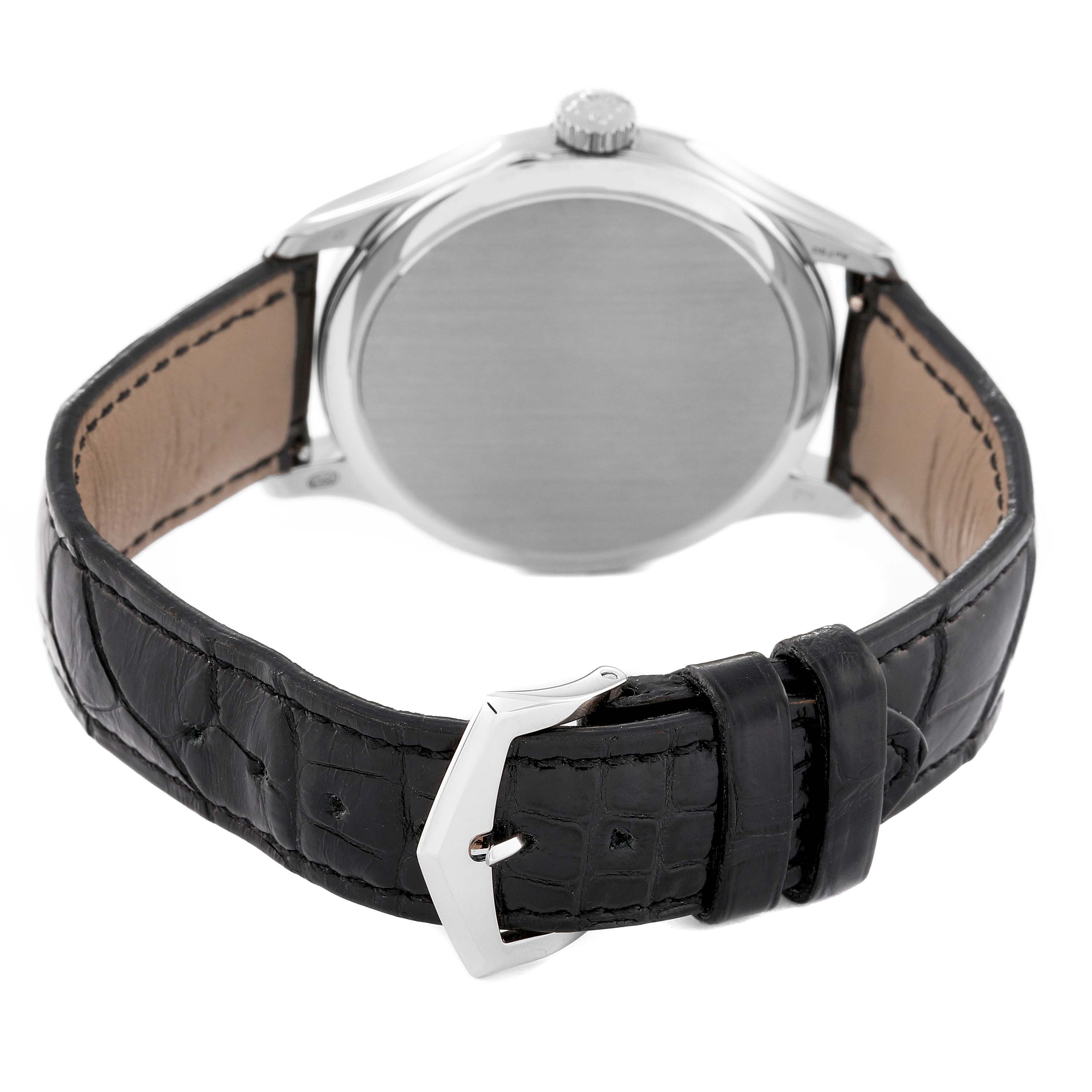 This image shows the back view of a Patek Philippe Calatrava 5227G-010 Men's White Gold Black Dial 5227G-010 Men's White Gold Black Dial watch, highlighting the case, crown, and black leather strap with a buckle.