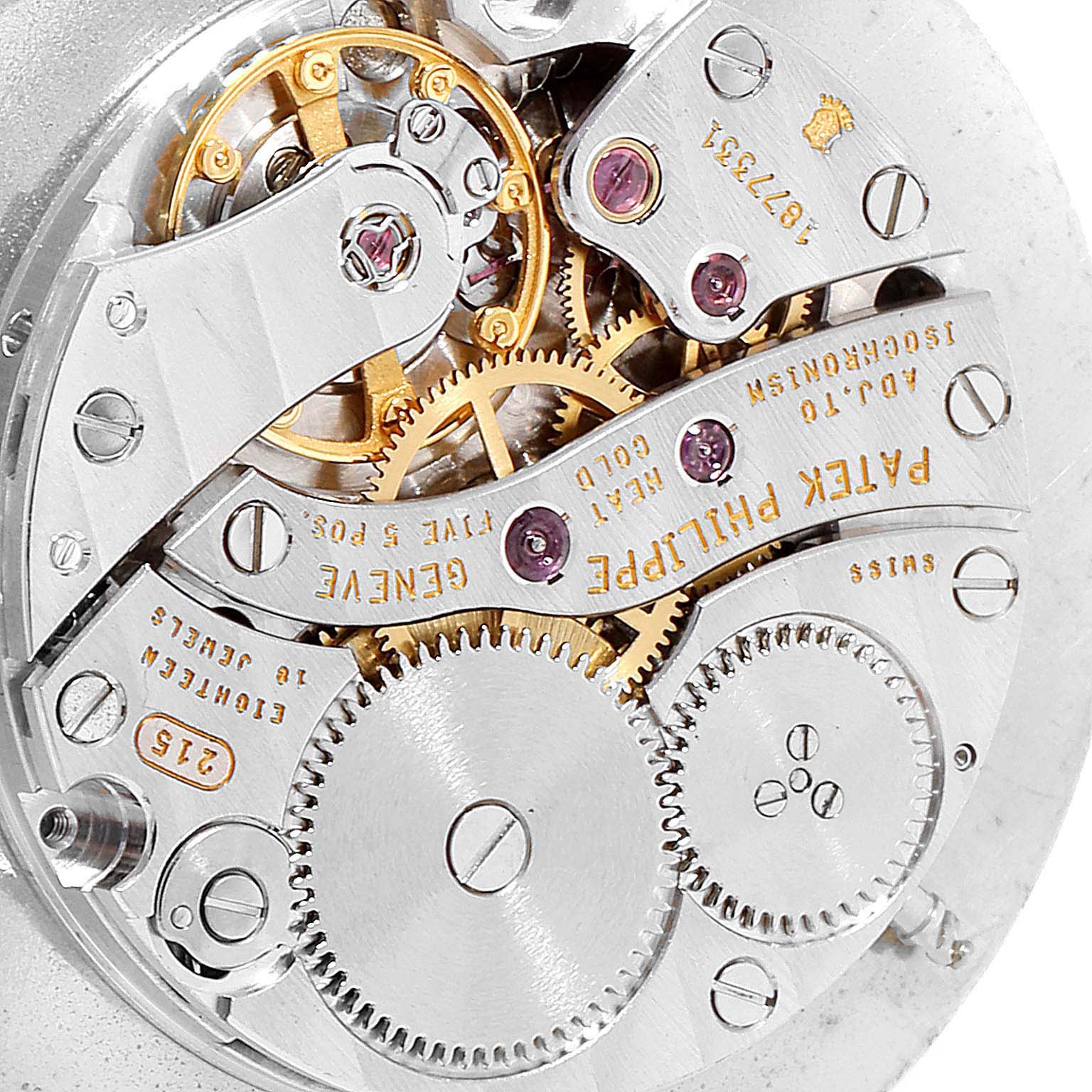 This image showcases the intricate inner mechanics of the Patek Philippe Calatrava 5022 Men's Rose Gold White Dial 5022 Men's Rose Gold White Dial watch, from a close-up angle.