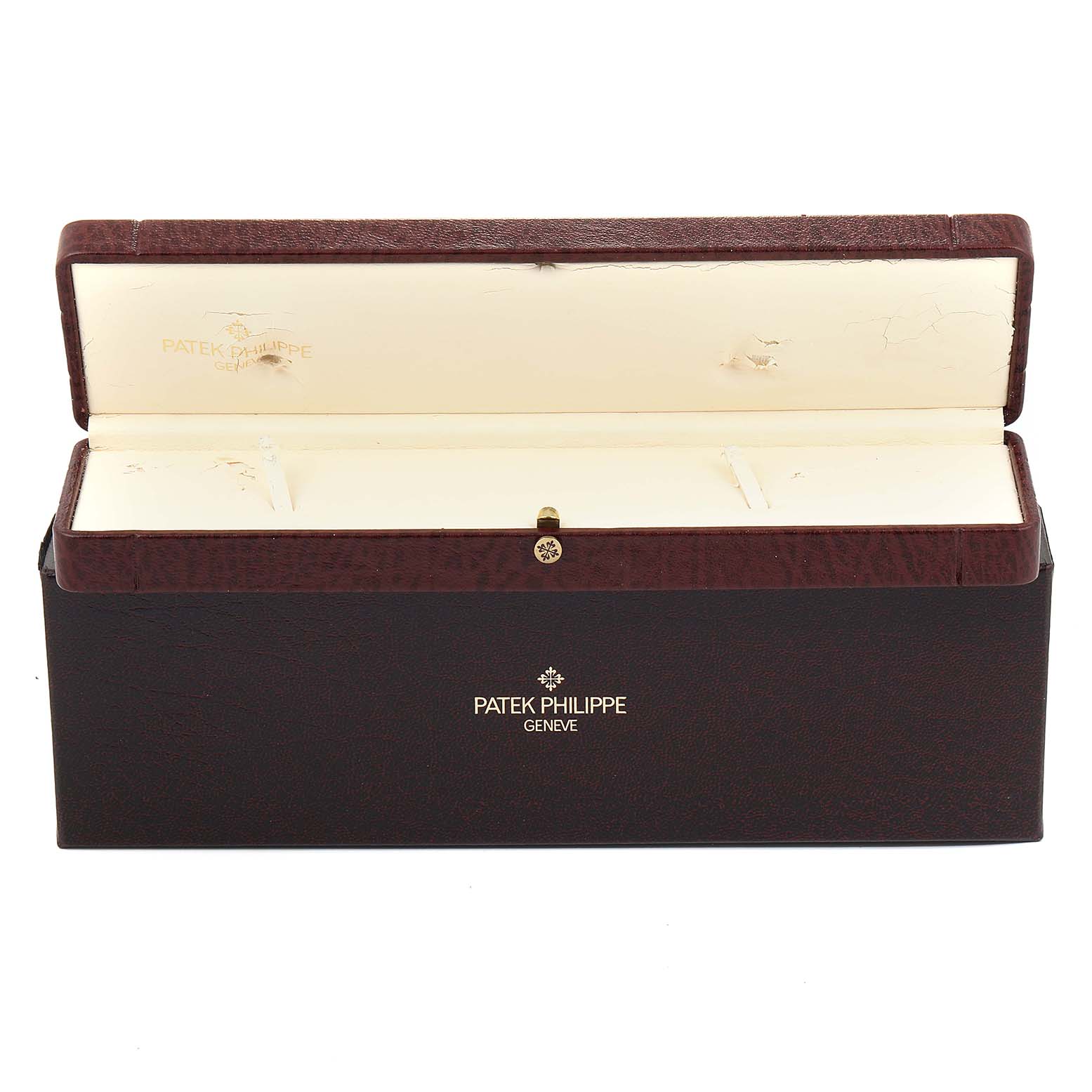 This image shows an empty, open Patek Philippe Calatrava 5022 Men's Rose Gold White Dial 5022 Men's Rose Gold White Dial watch box, displaying the inner compartments and brand logo.