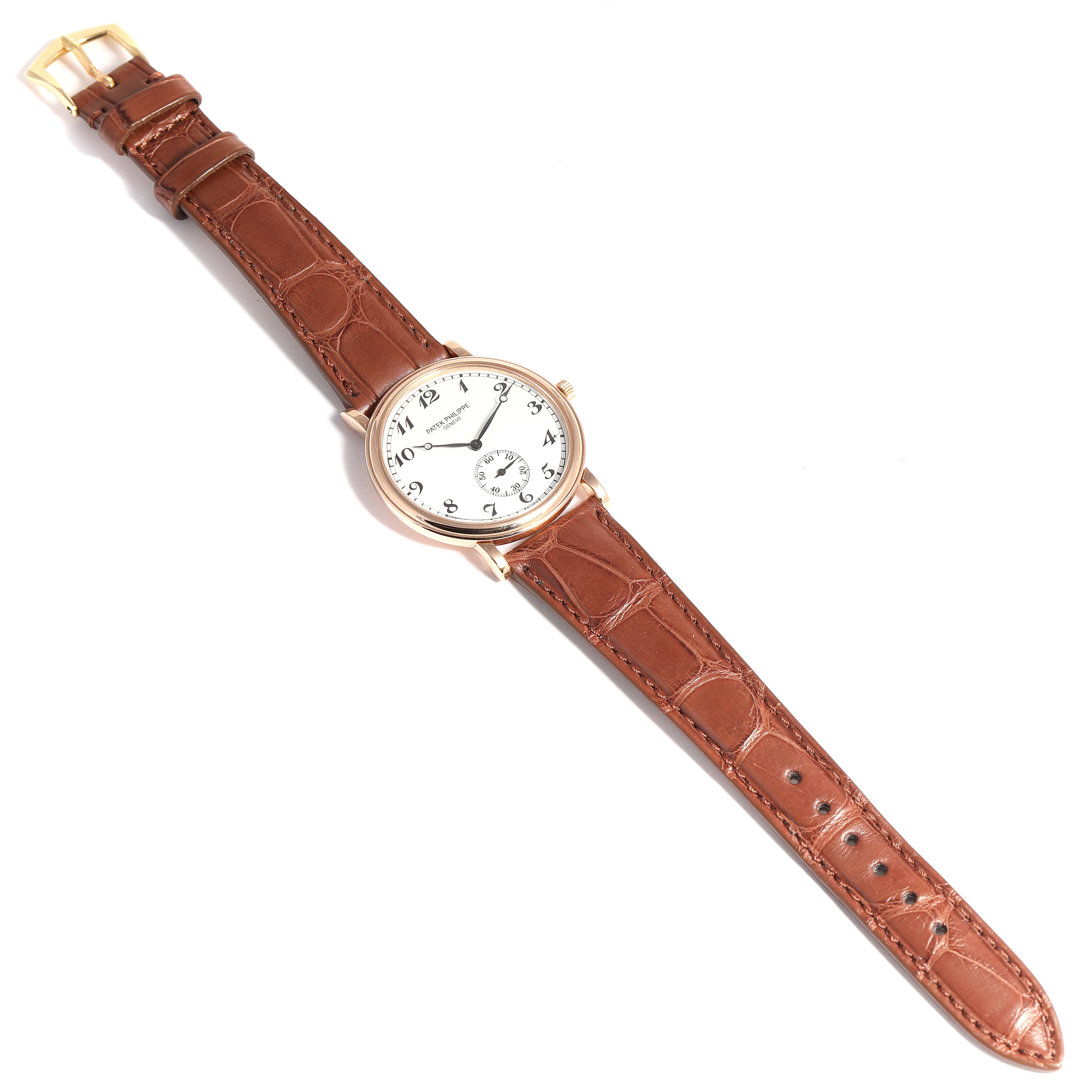 This image shows a top view of a Patek Philippe Calatrava 5022 Men's Rose Gold White Dial 5022 Men's Rose Gold White Dial watch with a brown leather strap and gold buckle.