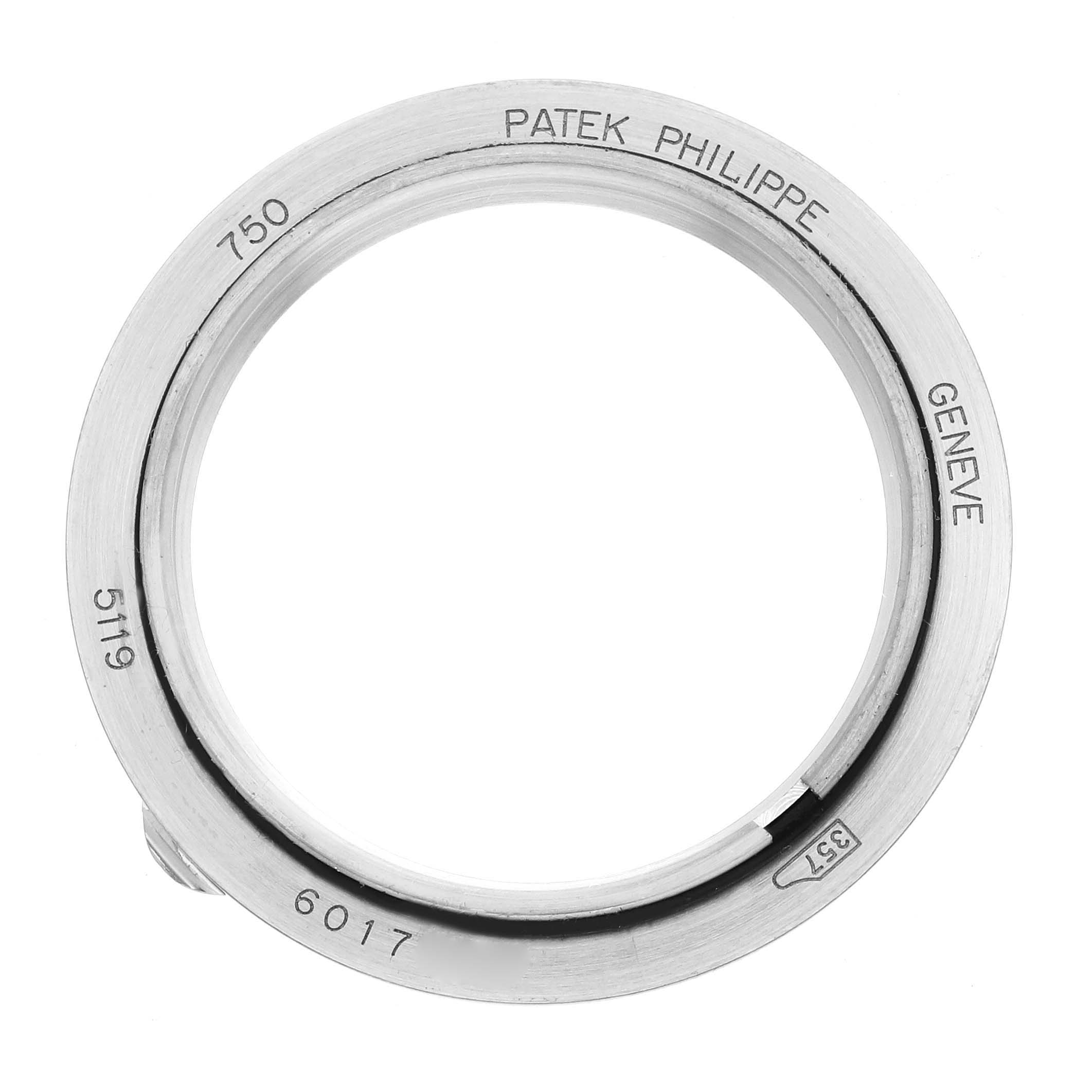 The image shows a close-up view of a Calatrava model bezel by Patek Philippe, featuring engraved markings.