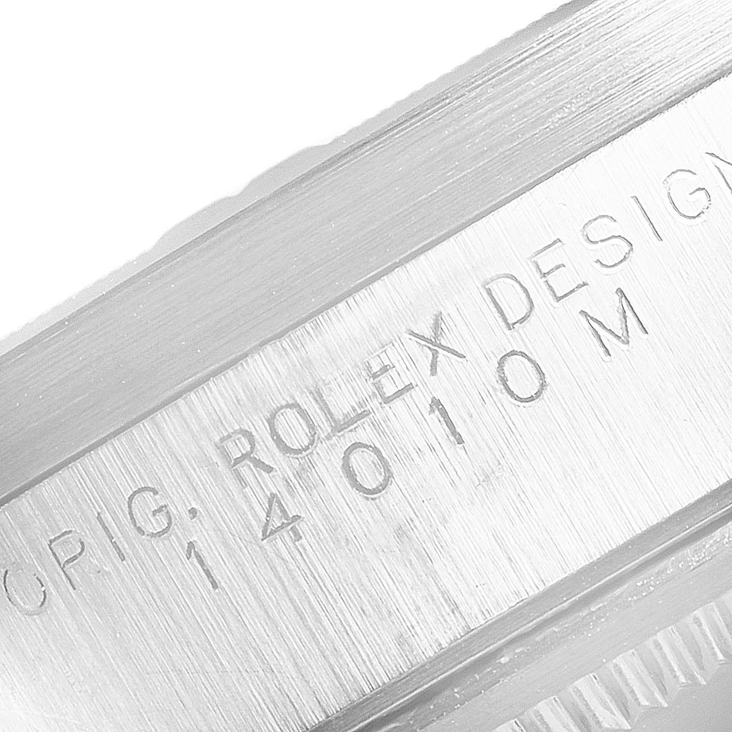 This image shows an up-close view of the engraved case side on a Rolex Air-King 14010 Men's Stainless Steel Blue Dial 14010 Men's Stainless Steel Blue Dial model.