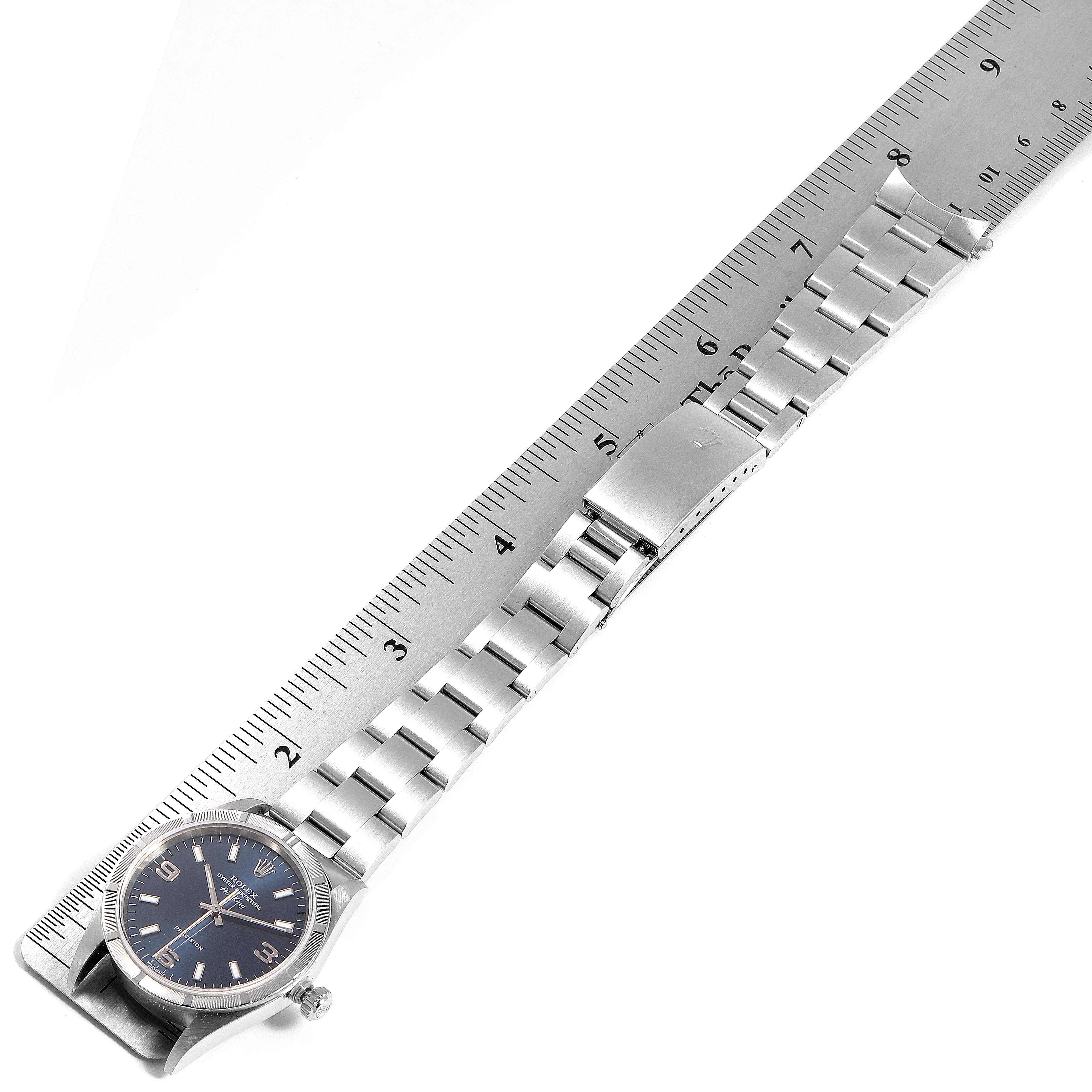 The image shows the Rolex Air-King 14010 Men's Stainless Steel Blue Dial 14010 Men's Stainless Steel Blue Dial watch and its metal bracelet laid flat next to a ruler for measurement.