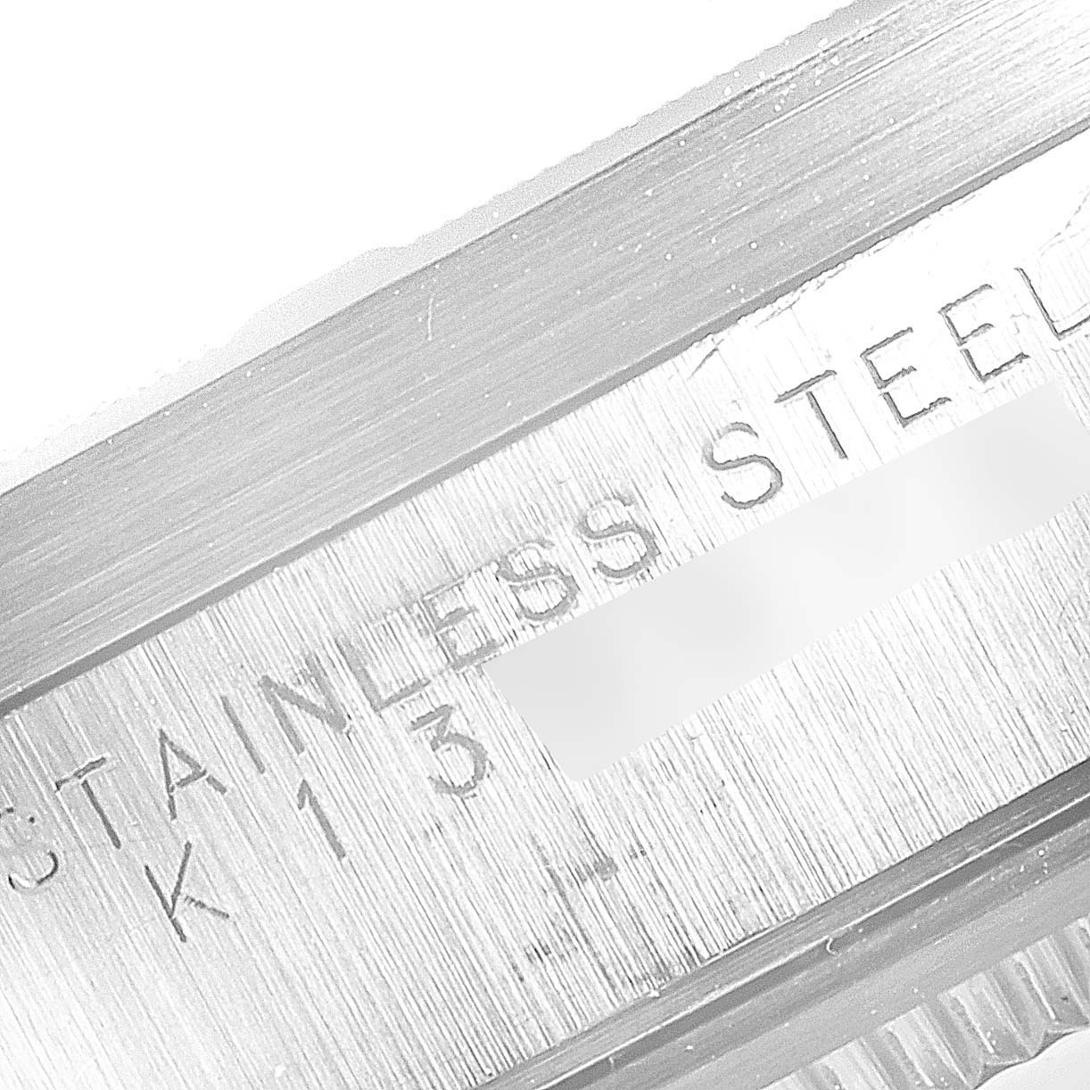 This image shows a close-up of the stainless steel bezel of a Rolex Air-King 14010 Men's Stainless Steel Blue Dial 14010 Men's Stainless Steel Blue Dial watch.