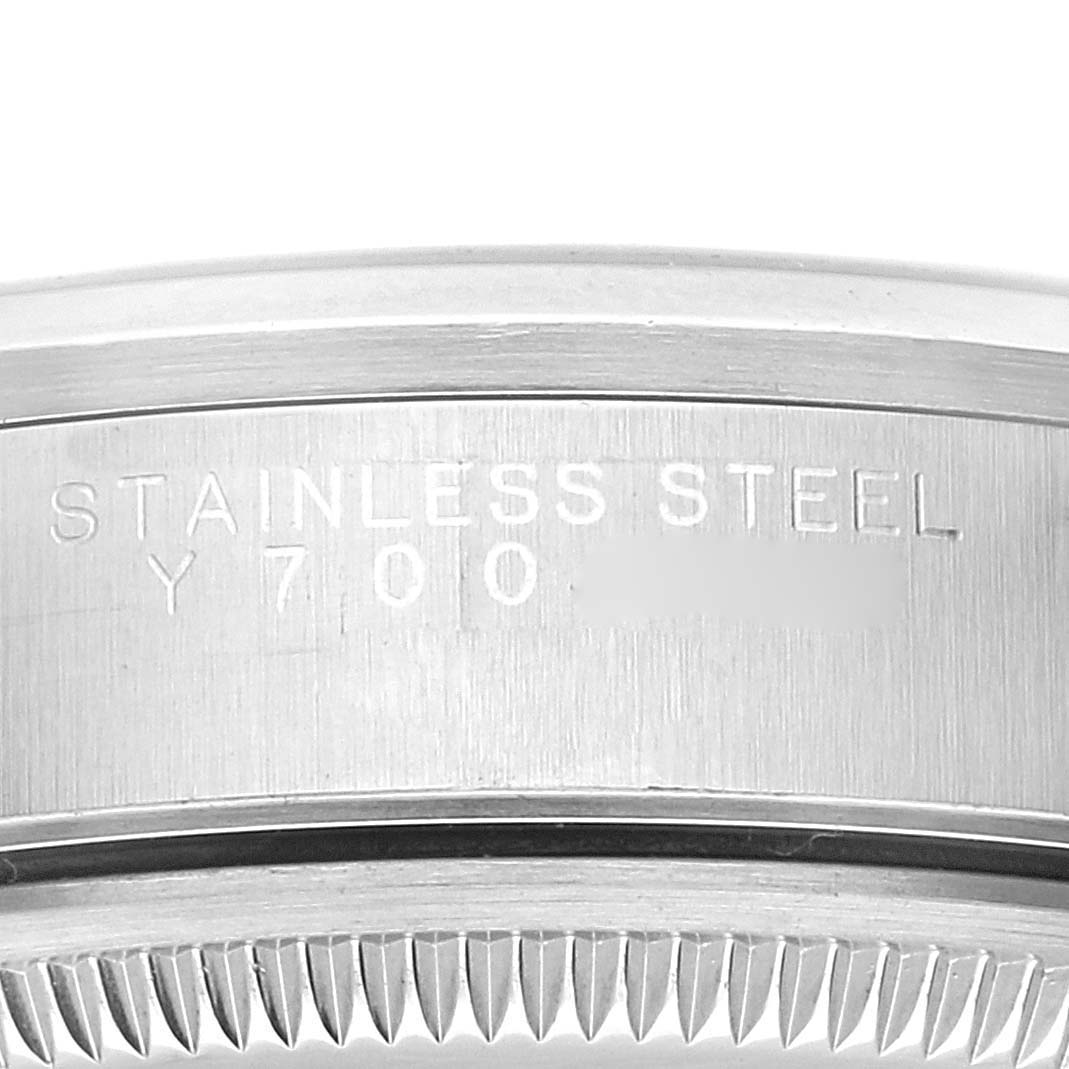 The image shows a close-up of the engraved case back and edge of the bezel of a Rolex Air-King 14000 Men's Stainless Steel Blue Dial 14000 Men's Stainless Steel Blue Dial watch.