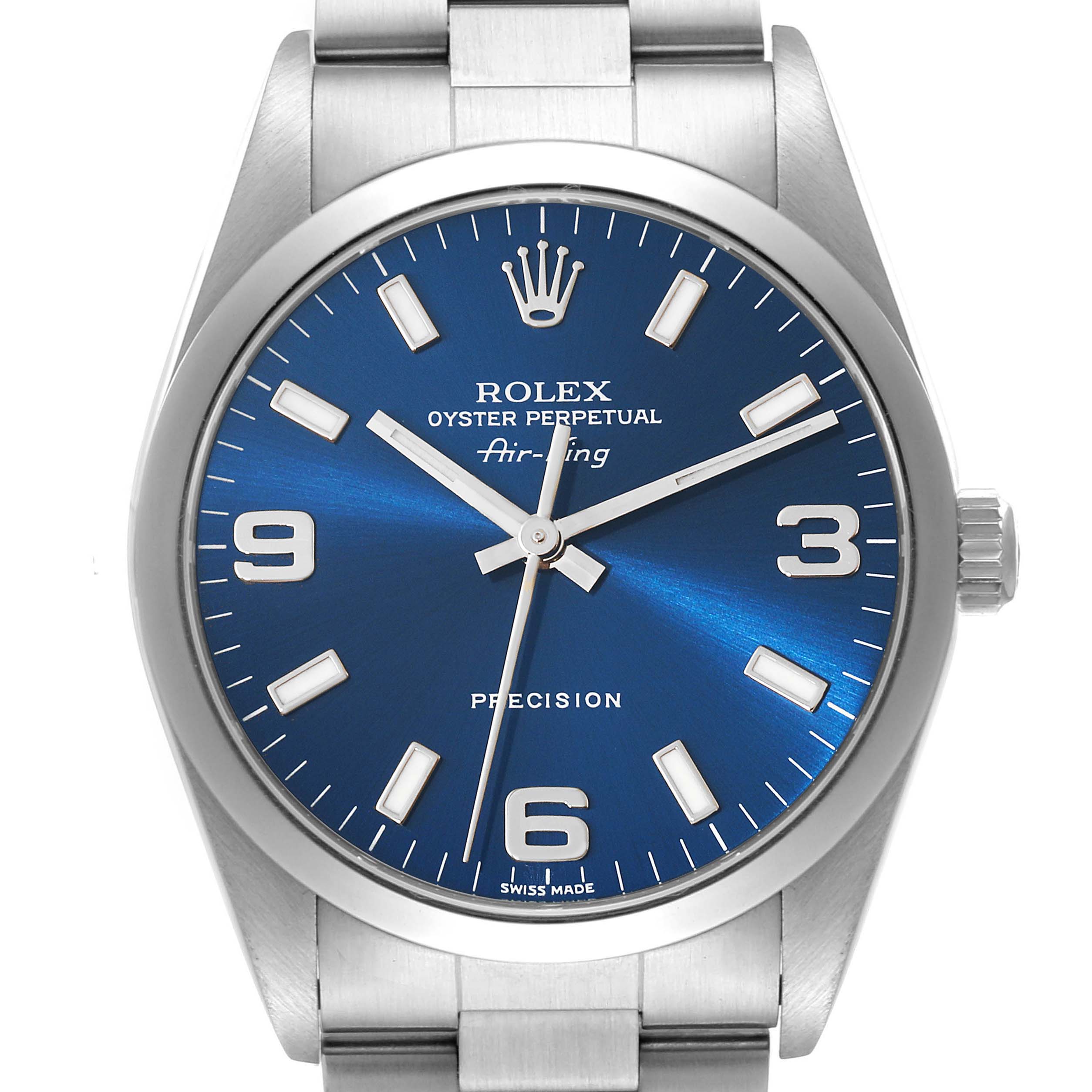 The image shows a front view of a Rolex Air-King 14000 Men's Stainless Steel Blue Dial 14000 Men's Stainless Steel Blue Dial watch, displaying its blue dial with numerals, crown, and part of the metal bracelet.