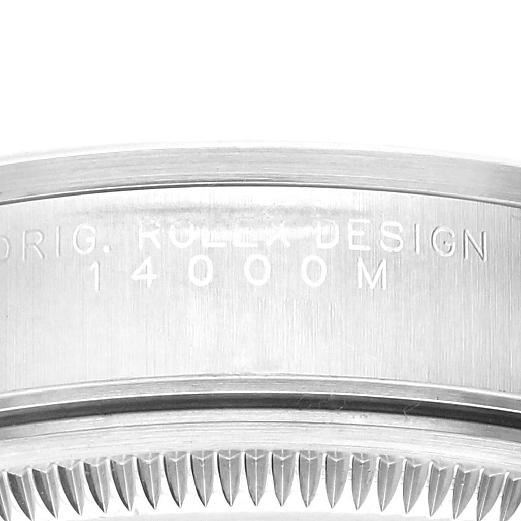 This close-up shows the side engraving and part of the bezel of a Rolex Air-King 14000 Men's Stainless Steel Blue Dial 14000 Men's Stainless Steel Blue Dial watch.