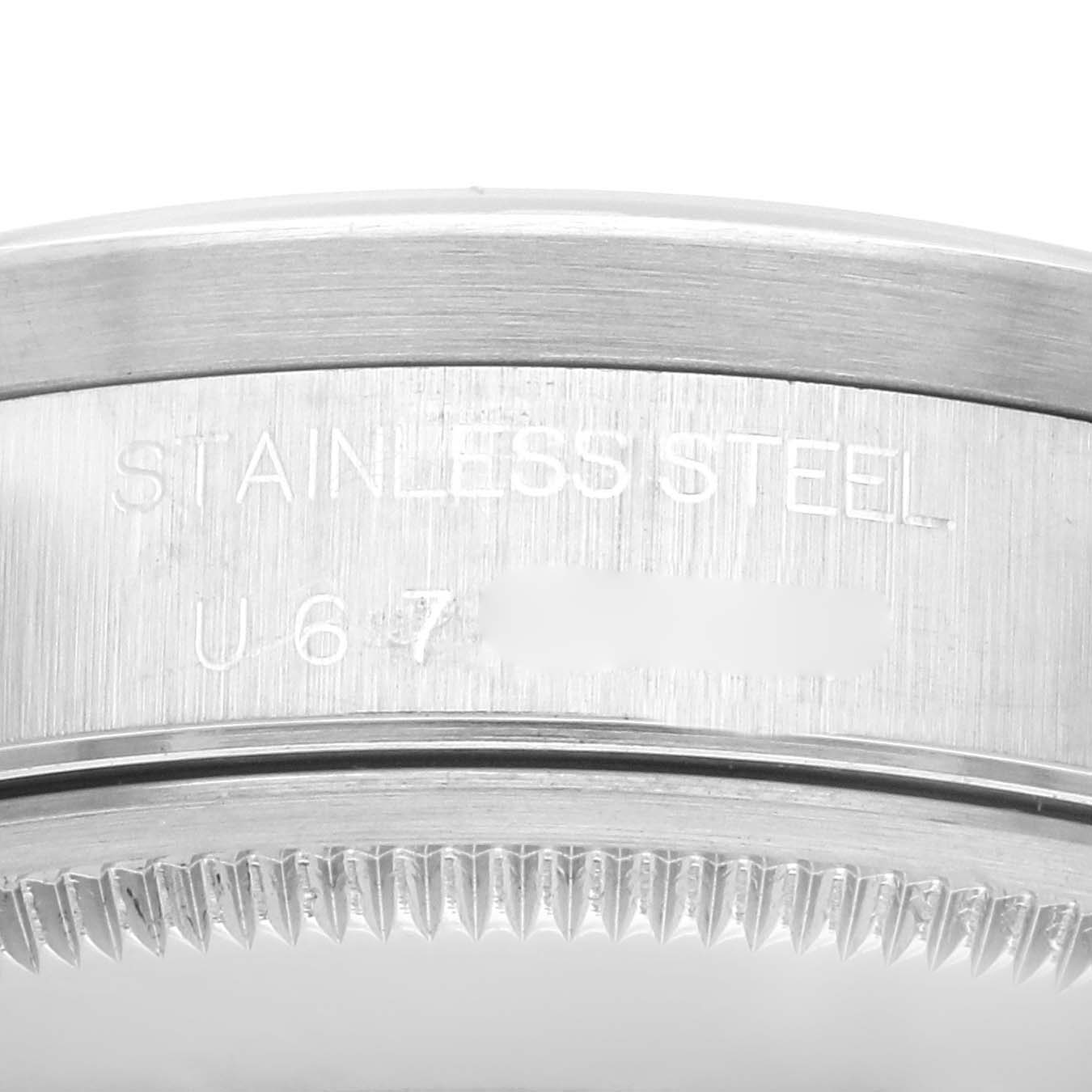 This close-up image shows the side and partial back of a Rolex Air-King 14010 Men's Stainless Steel Silver Dial 14010 Men's Stainless Steel Silver Dial watch, highlighting the stainless steel material and some engraved text.