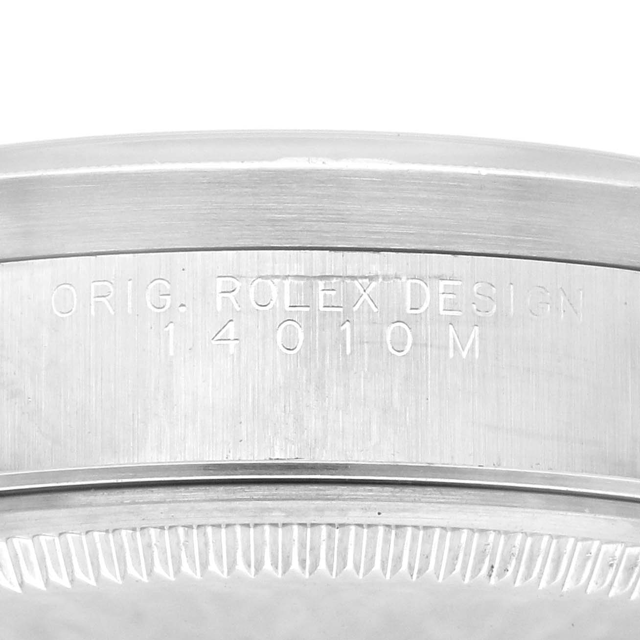 This image shows the side engraving on the bezel of a Rolex Air-King 14010M Men's Stainless Steel Silver Dial 14010M Men's Stainless Steel Silver Dial watch, displaying the model number.