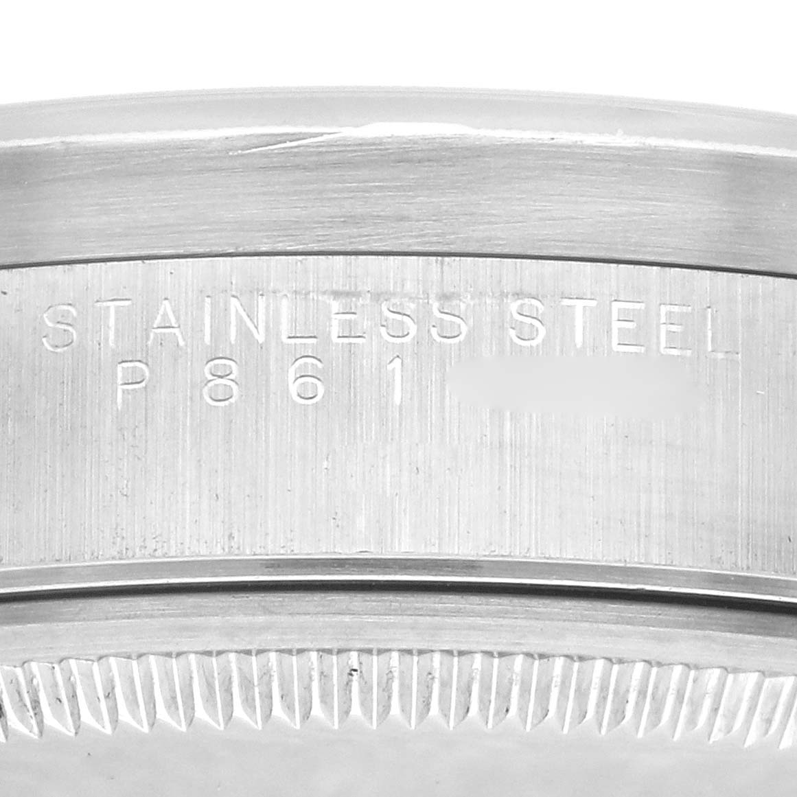This image shows a close-up of the side edge of the stainless steel case on a Rolex Air-King 14010M Men's Stainless Steel Silver Dial 14010M Men's Stainless Steel Silver Dial watch.