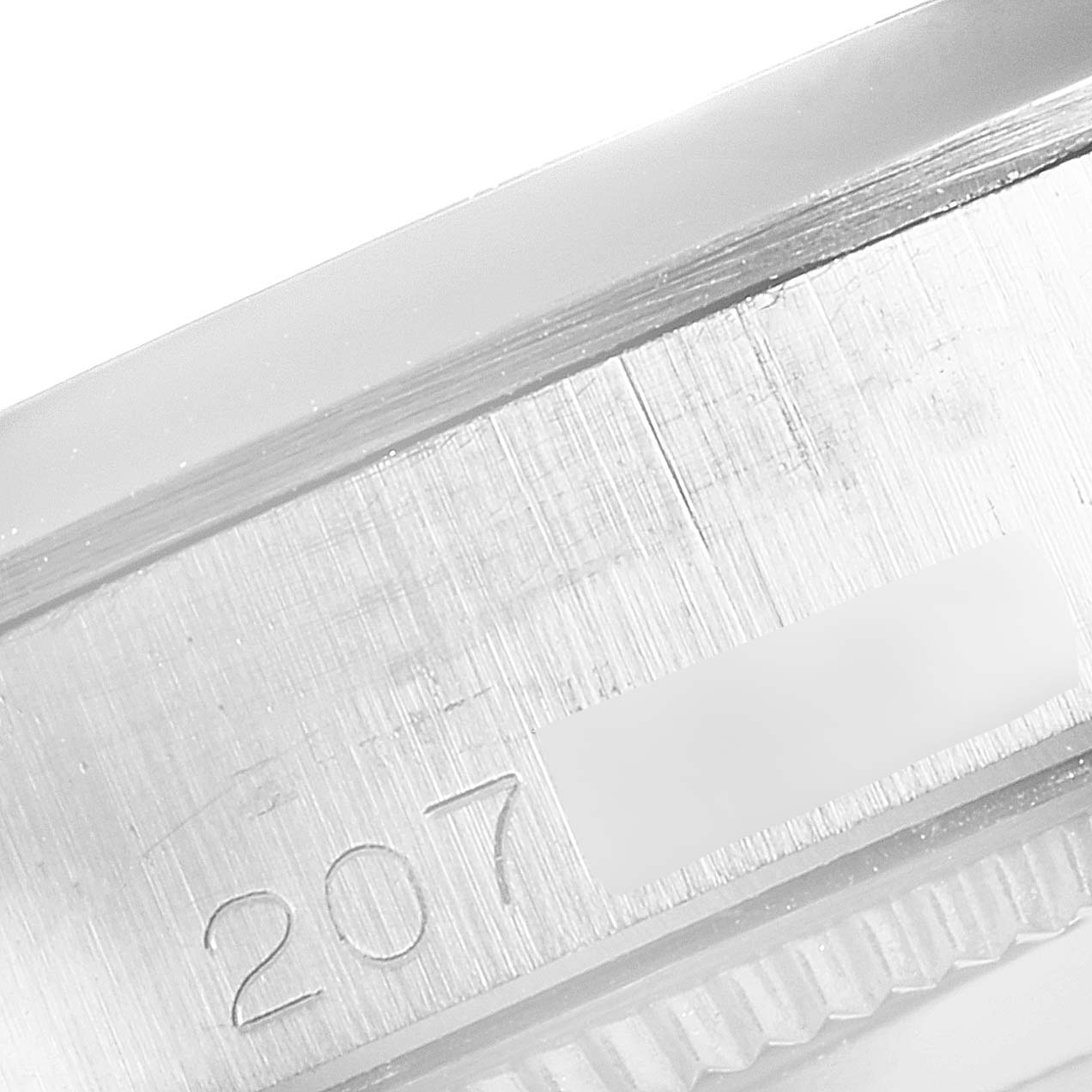 The image shows a close-up angle of the Rolex Vintage Collection 5500 Men's Stainless Steel Silver Dial 5500 Men's Stainless Steel Silver Dial watch's engraved serial number on its case.