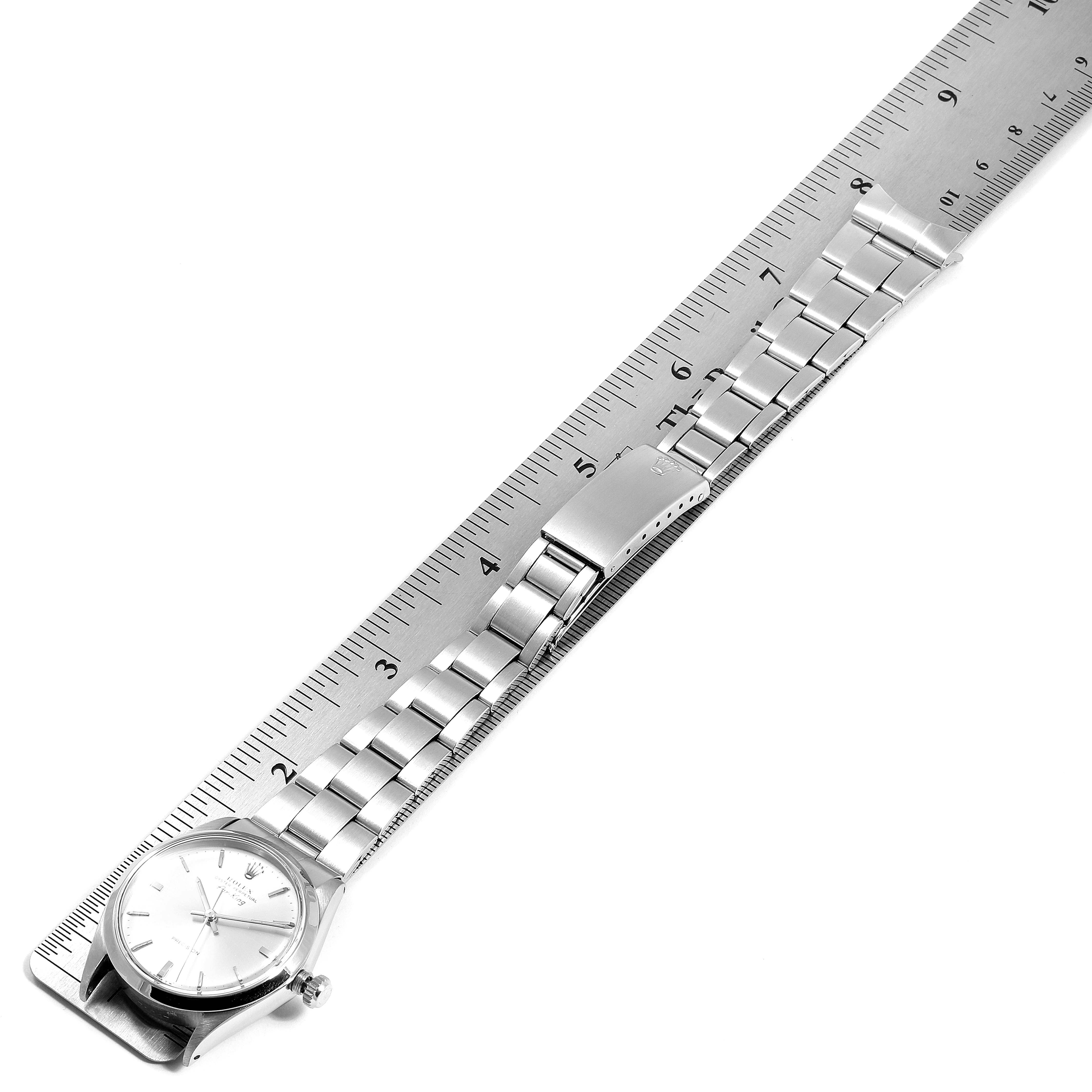 The image shows a Rolex Vintage Collection 5500 Men's Stainless Steel Silver Dial 5500 Men's Stainless Steel Silver Dial watch laid flat and measured against a ruler, displaying the bracelet and clasp.