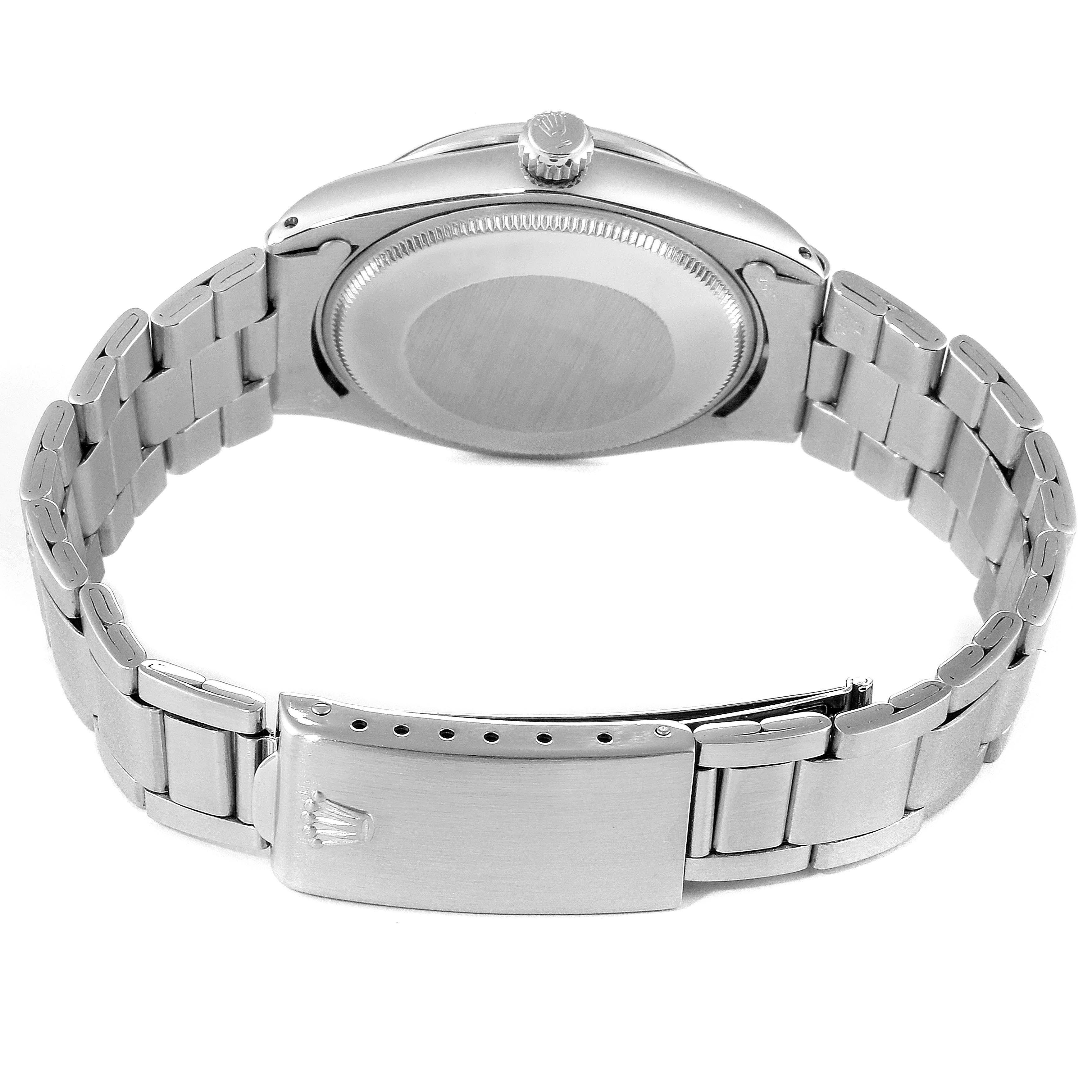 The image shows the back case and bracelet clasp of a Vintage Collection model by Rolex from a rear angle.