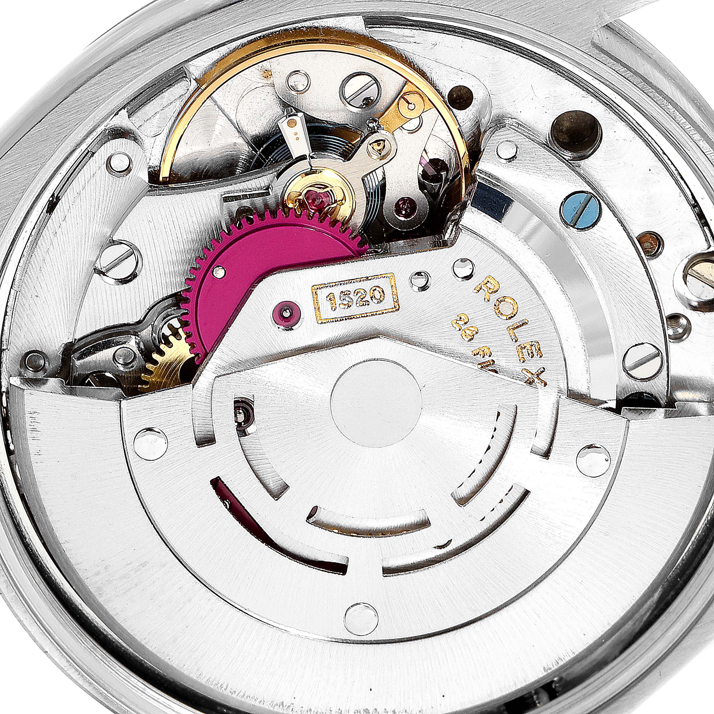 This image shows a close-up of the mechanical movement of a Vintage Collection Rolex watch.