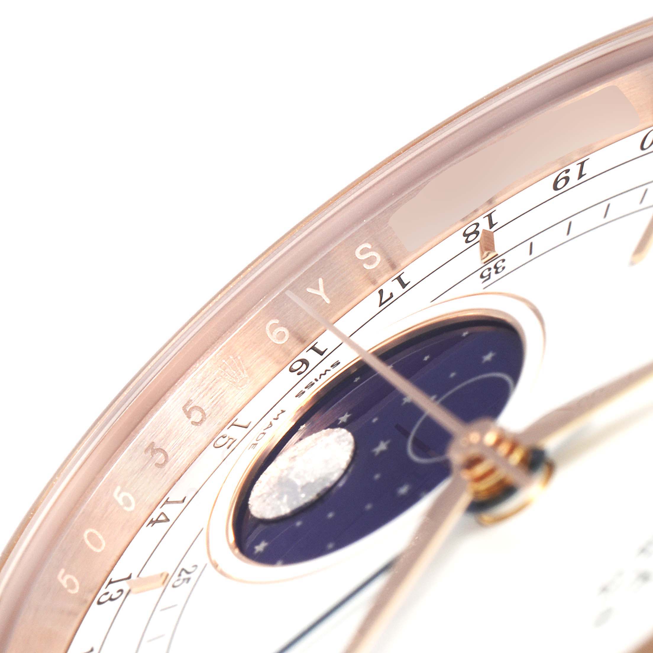 This close-up image shows the dial of the Rolex Cellini 50535 Men's Rose Gold White Dial 50535 Men's Rose Gold White Dial model, highlighting the date and moon phase indicators.